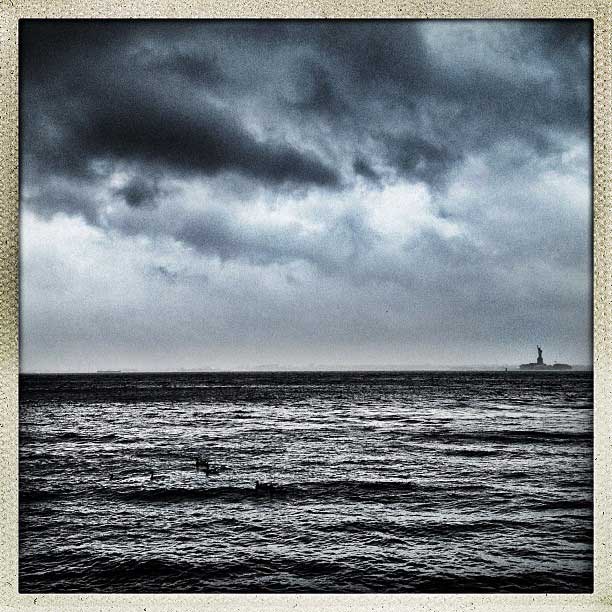 Storm clouds bear down on the Statue of Liberty as Hurricane Sandy approaches New York City