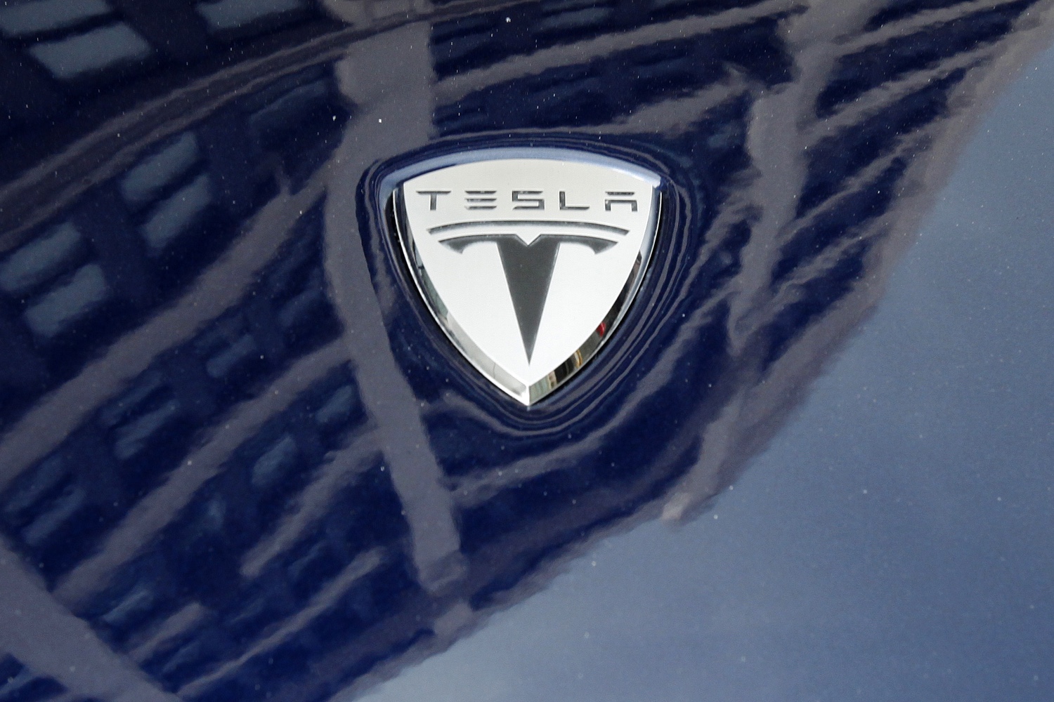 A logo of Tesla Motors on an electric car model is seen outside a showroom in New York on June 28, 2010. (Shannon Stapleton—Reuters)