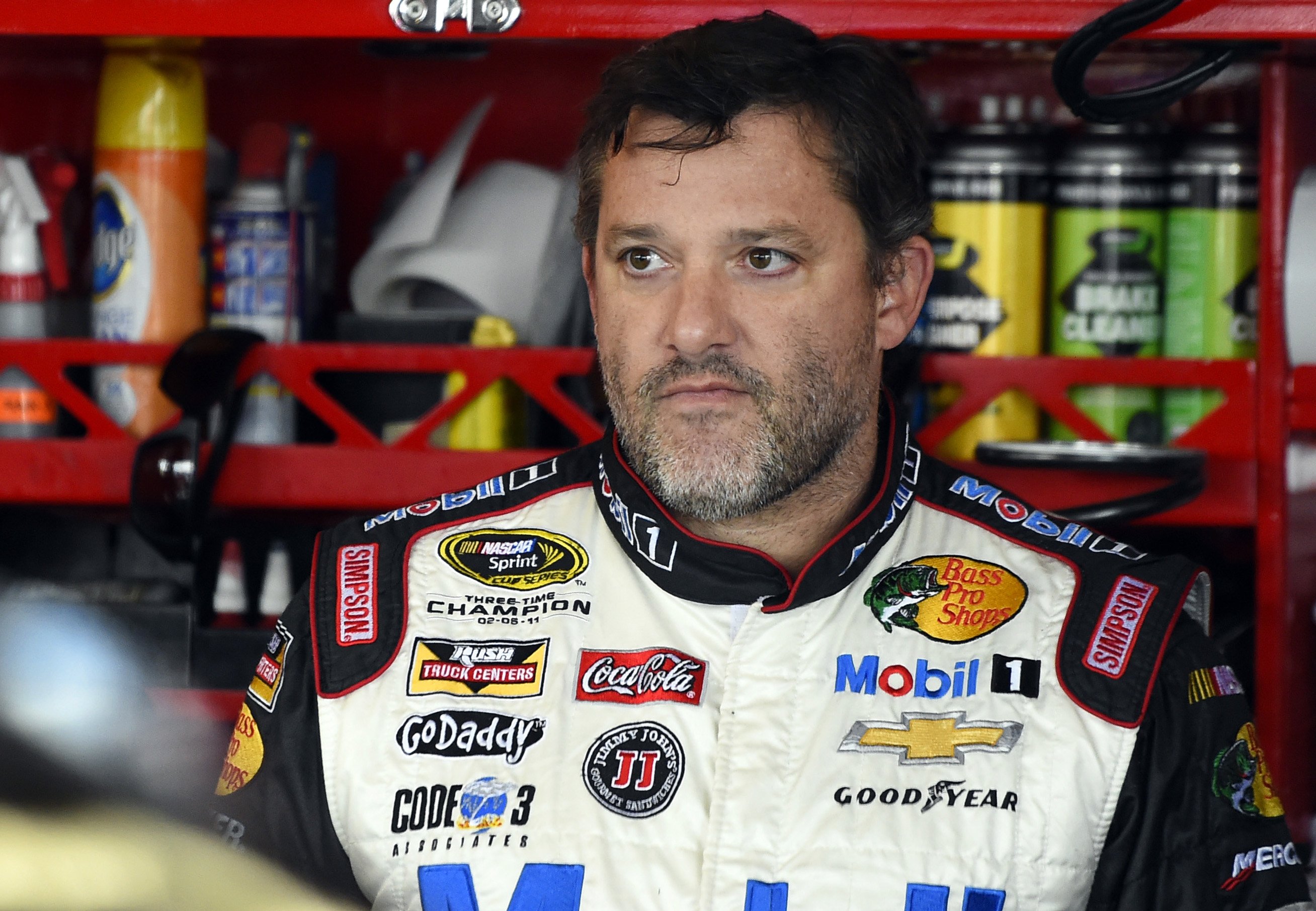 NASCAR driver Tony Stewart (14) looks out from his garage during a practice for the NASCAR Sprint Cup Series auto race at Chicagoland Speedway in Joliet, Ill. on Sept. 13, 2014. (Paul J. Bergstrom—AP)