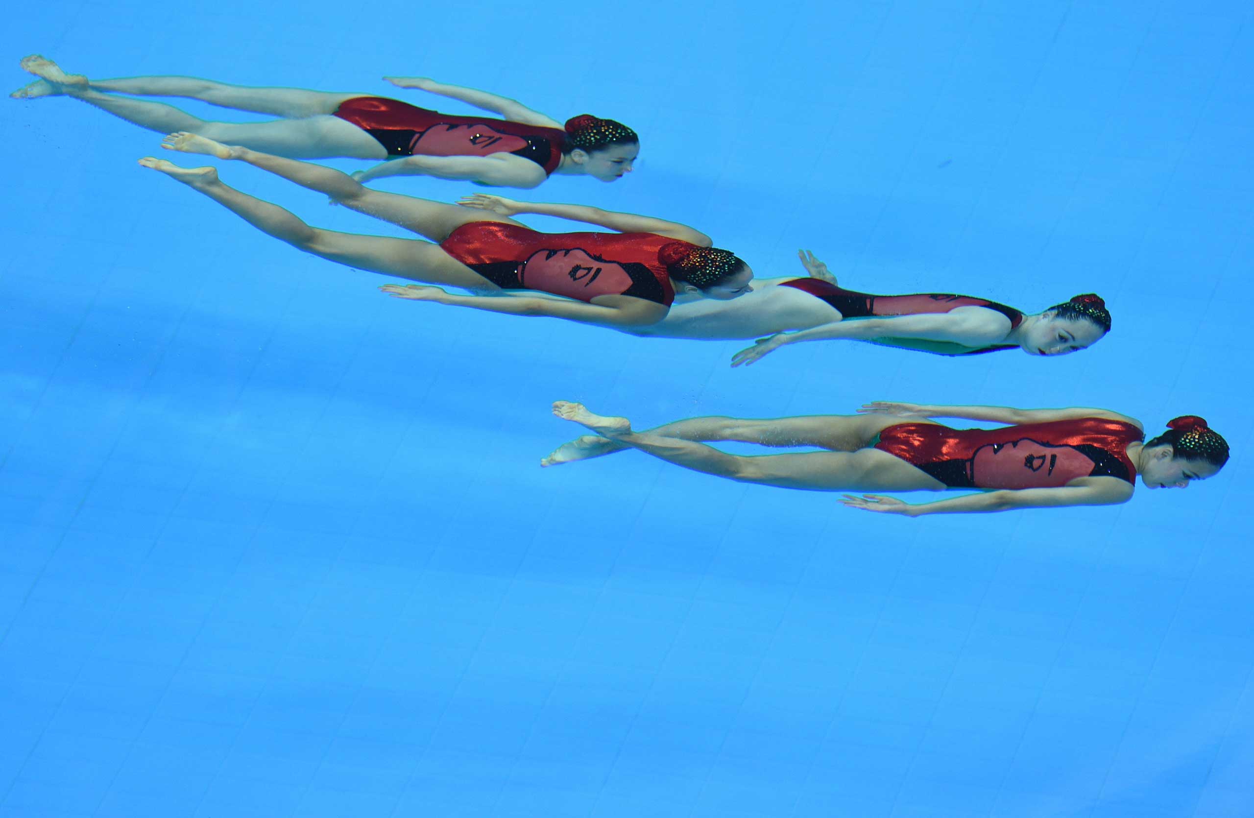 Sept. 23, 2014. Japan's swimmers compete in the free combination synchronised swimming event final during the 2014 Asian Games at the Munhak Park Tae-hwan Aquatics Centre.
