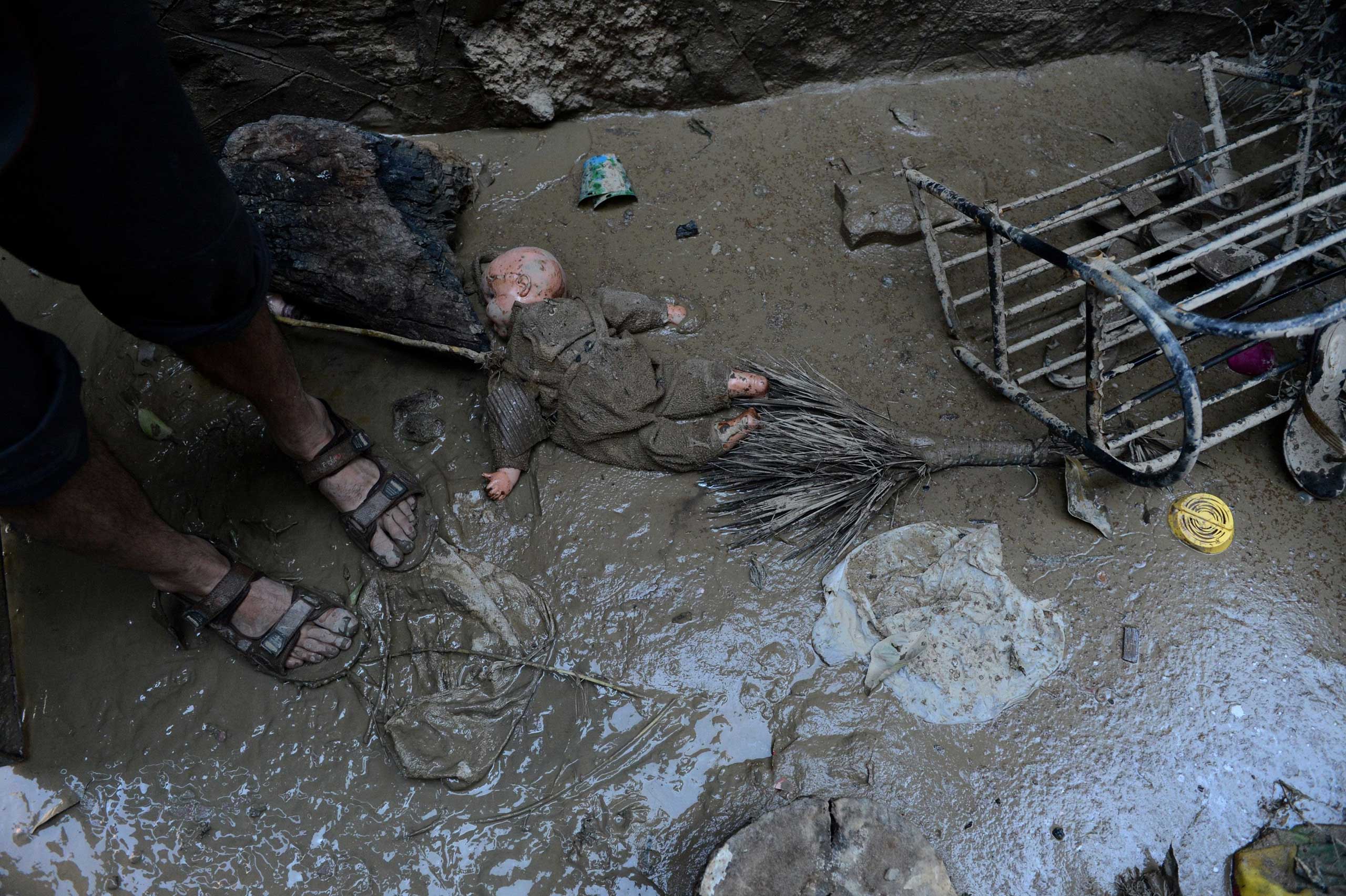 Sept. 19, 2014. 
                              A doll lies in the mud inside a flood-damaged house in central Srinagar, India.