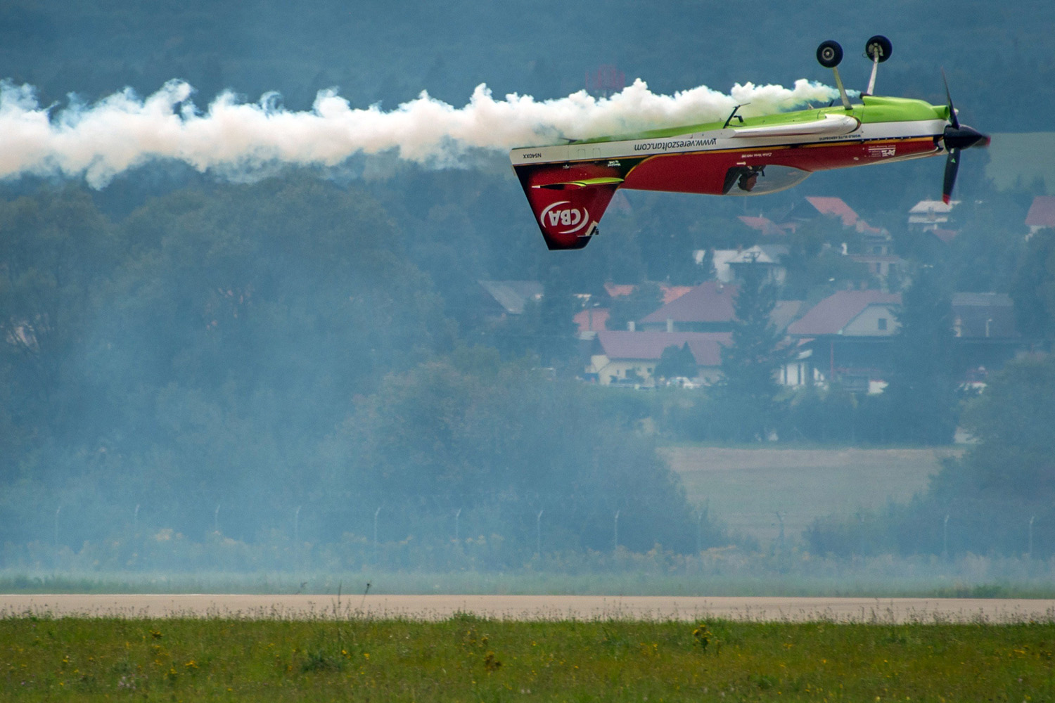 Legendary acrobatic pilot Zoltan Veres of Hungary on his MXS aircraft demonstrates his skills with his F-16 at the Slovak International Air Fest SIAF 2014 at the Airforce Base of Sliac, Slovakia on Aug. 30, 2014.