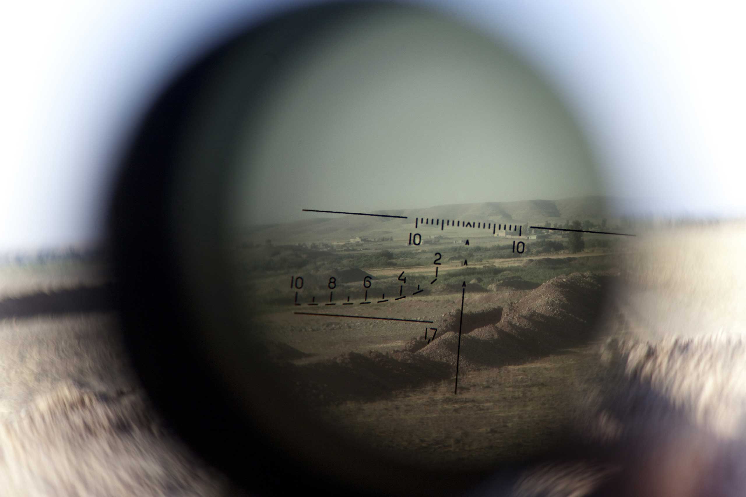 Sept. 15, 2014. The horizon is seen through a telescopic rifle belonging to a Kurdish Peshmerga sniper on the front line in the Gwer district, Erbil, the capital of the Kurdish autonomous region in northern Iraq.