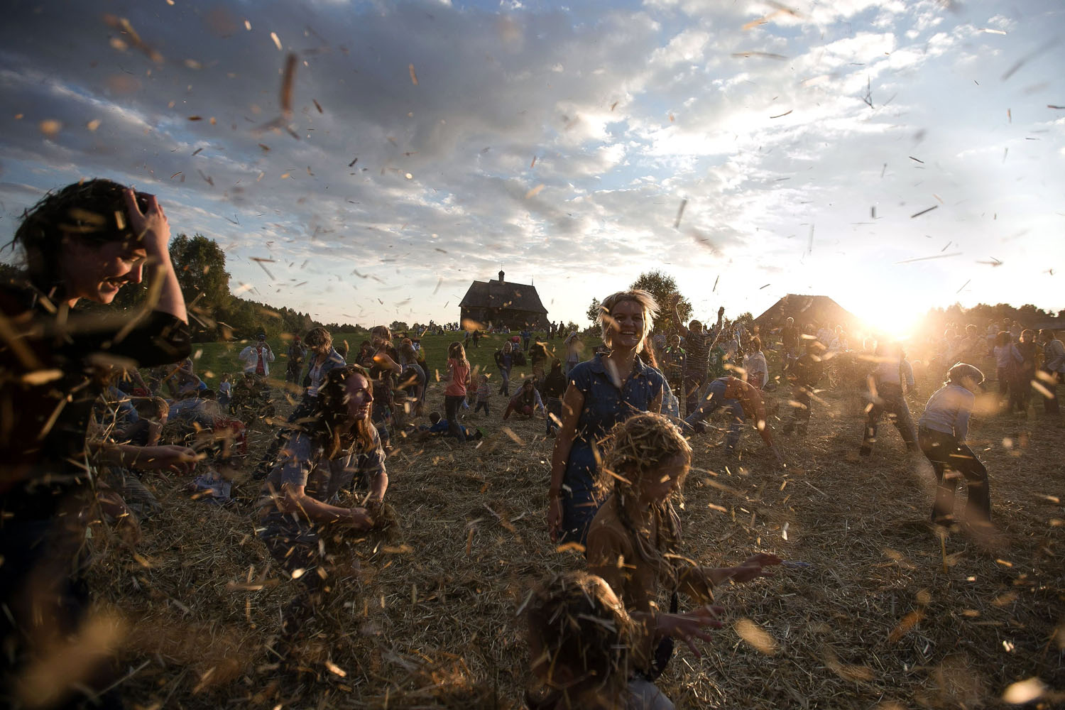 Sept. 6, 2014. People dance and throw straw during a traditional festival in village Ozerco, some 10 km from Minsk.