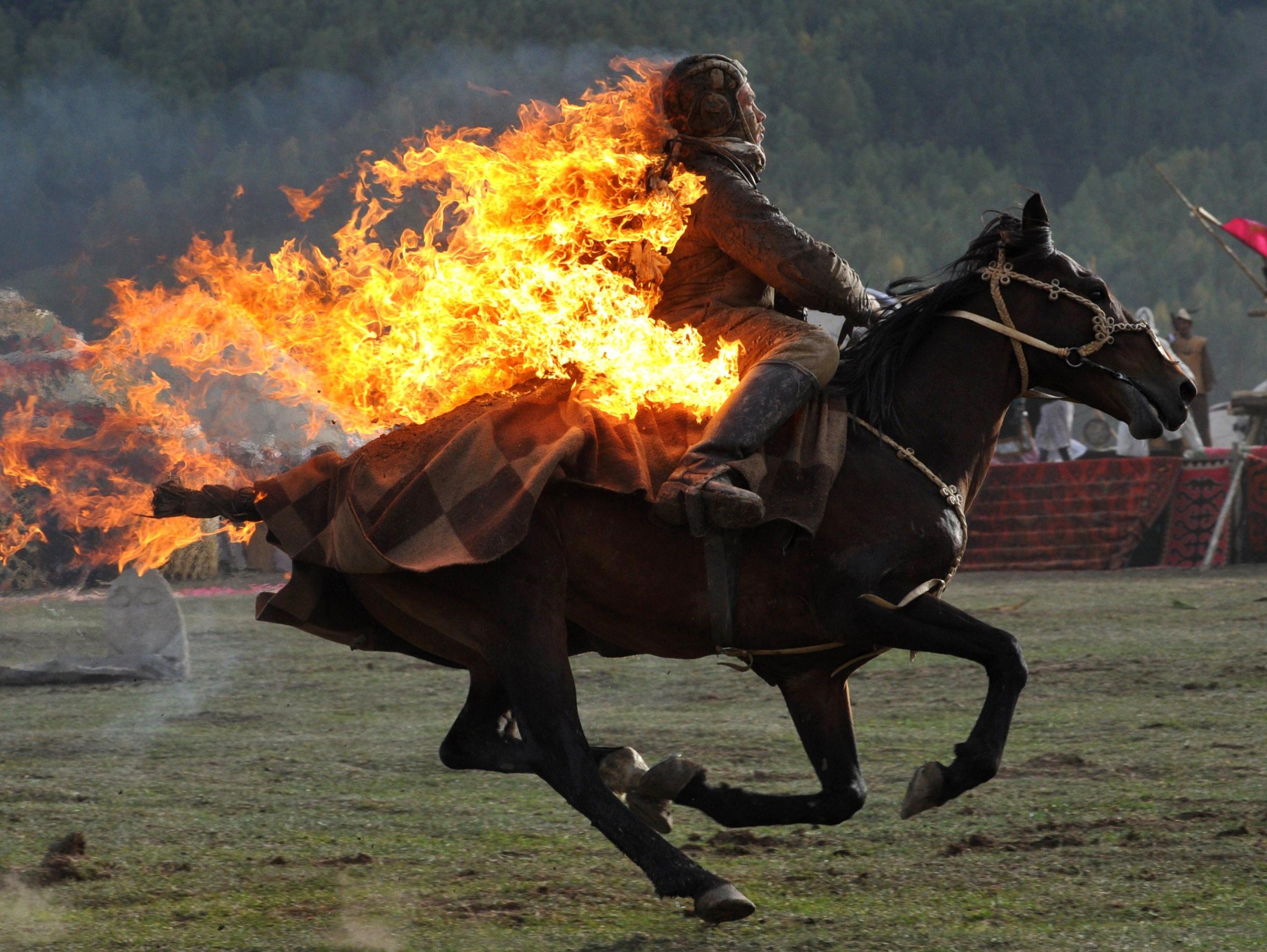 A Kyrgyz stuntman performing during the first World Nomad Games in the Kyrchin (Semenovskoe) gorge, about 300 km from Bishkek on Sept. 10, 2014.