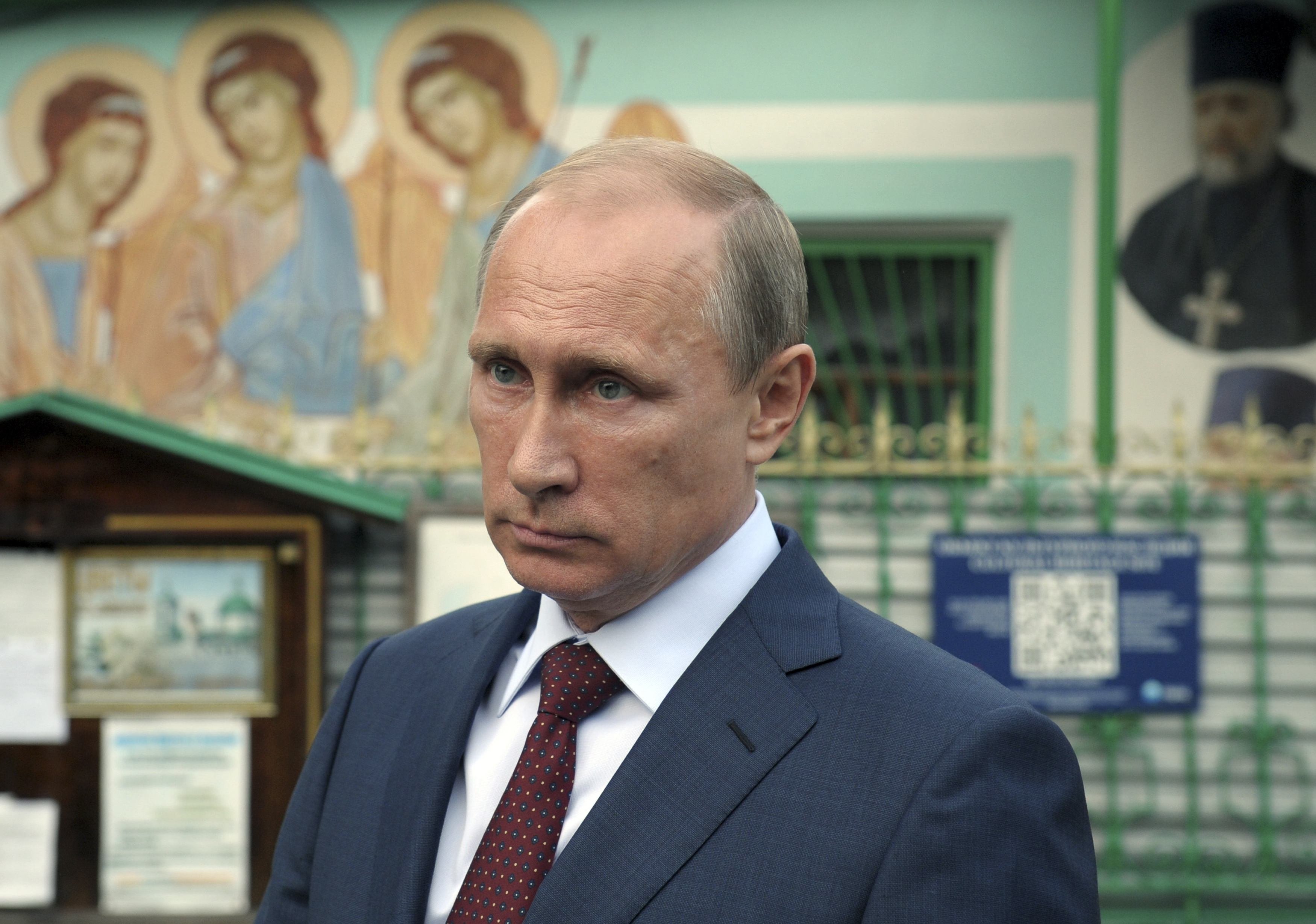 Russia's President Putin leaves the Life-giving Trinity church in Moscow