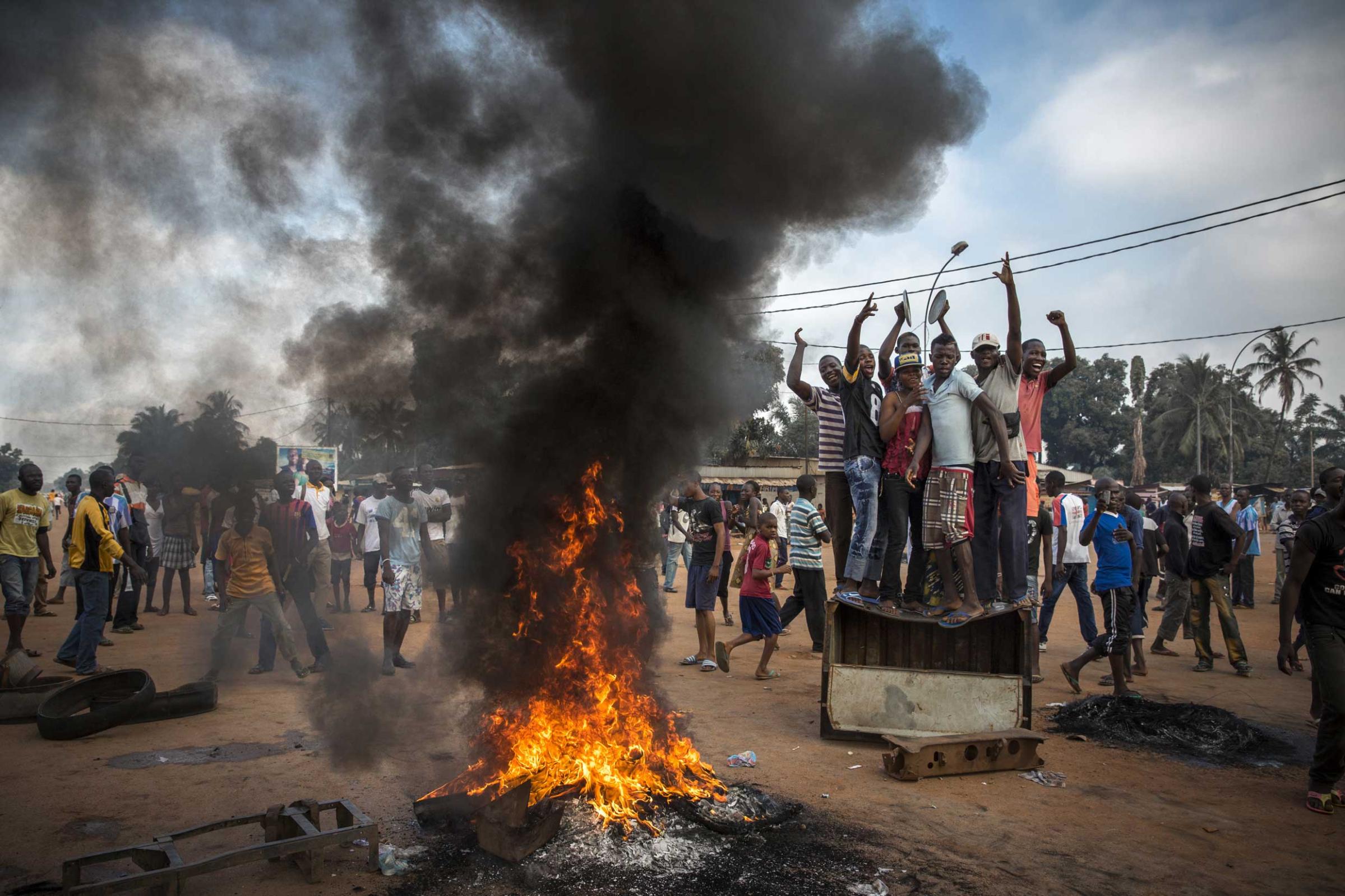 2nd Prize General News Stories. 17 November 2013, Central African Republic. Demonstrators gather on a street in Bangui to call for the resignation of interim President Michel Djotodia following the murder of Judge Modeste Martineau Bria by members of Seleka. Bangui, Central African Republic.