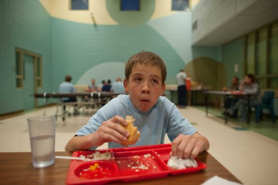 Vinny eats his first meal in the detention center cafeteria.