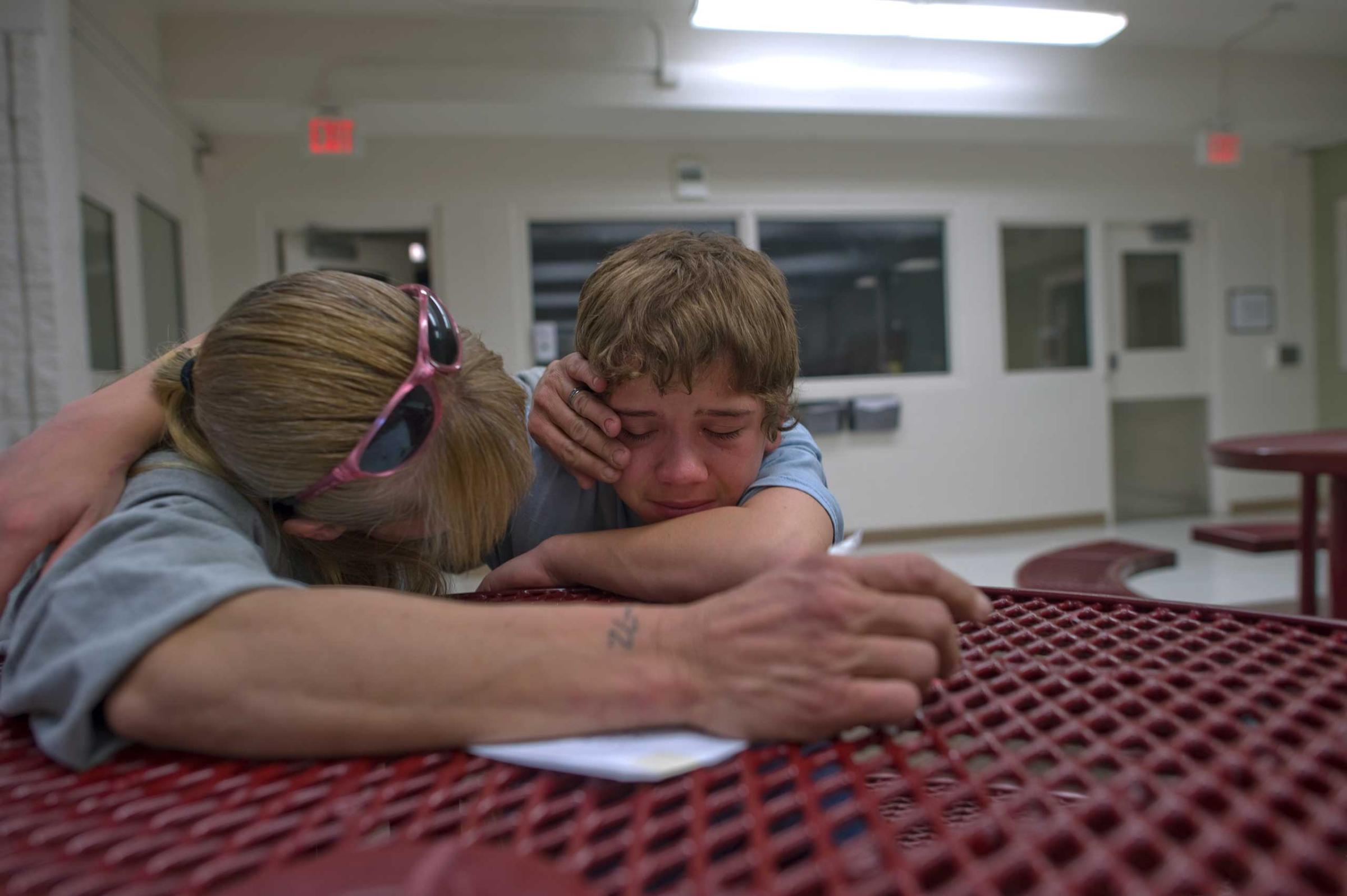 Vinny's mother Eve comforts him during visitation at the detention center.