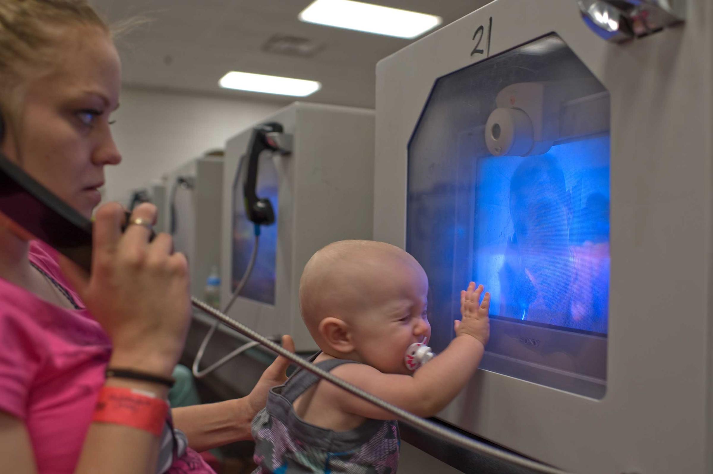 Felicia and their 10-month-old daughter Lily see David through video visitation.