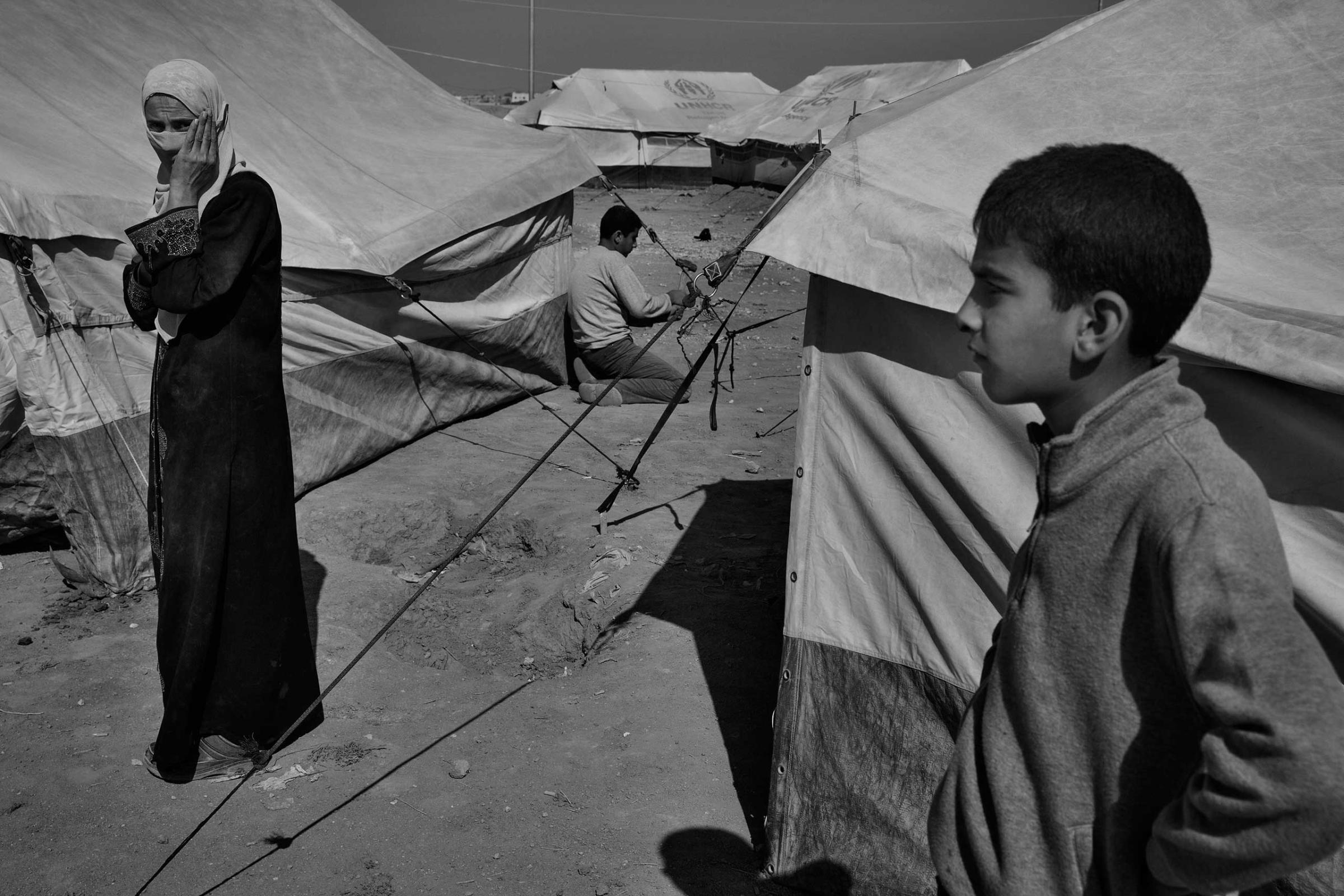 December 2013. Za'atari refugee camp, Jordan. New arrivals from Syria setting up tents supplied by the United Nations High Commissioner for Refugees.