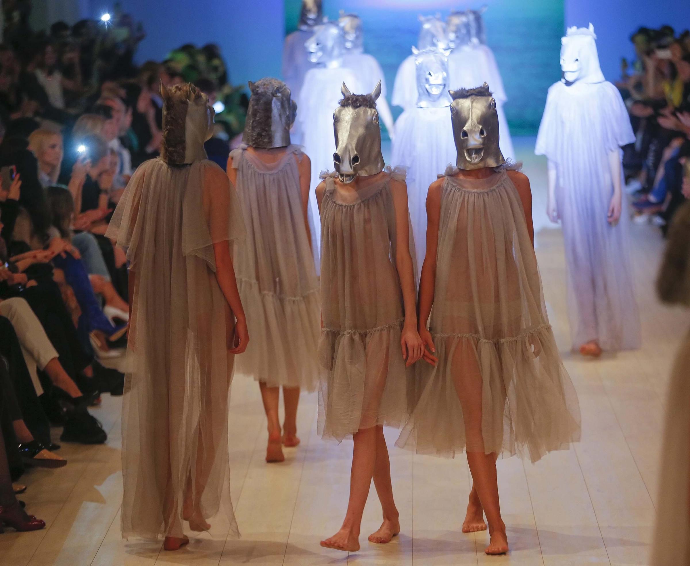 Models present creations by Ukrainian designer Victoria Gres during the Ukrainian Fashion Week in Kiev, Ukraine on Oct. 15, 2014.