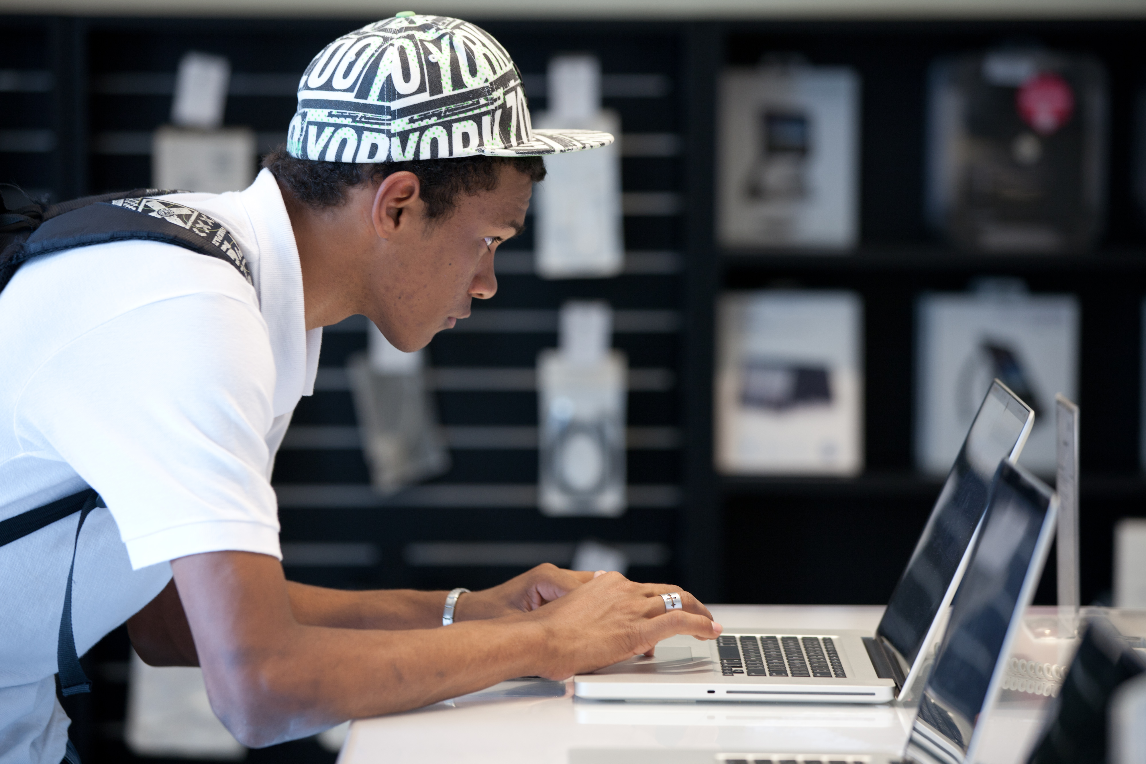 A Brazilian man looks at Apple's Macbook pro at the retail shop of Apple products in Sao Paulo. (AFP&mdash;AFP/Getty Images)