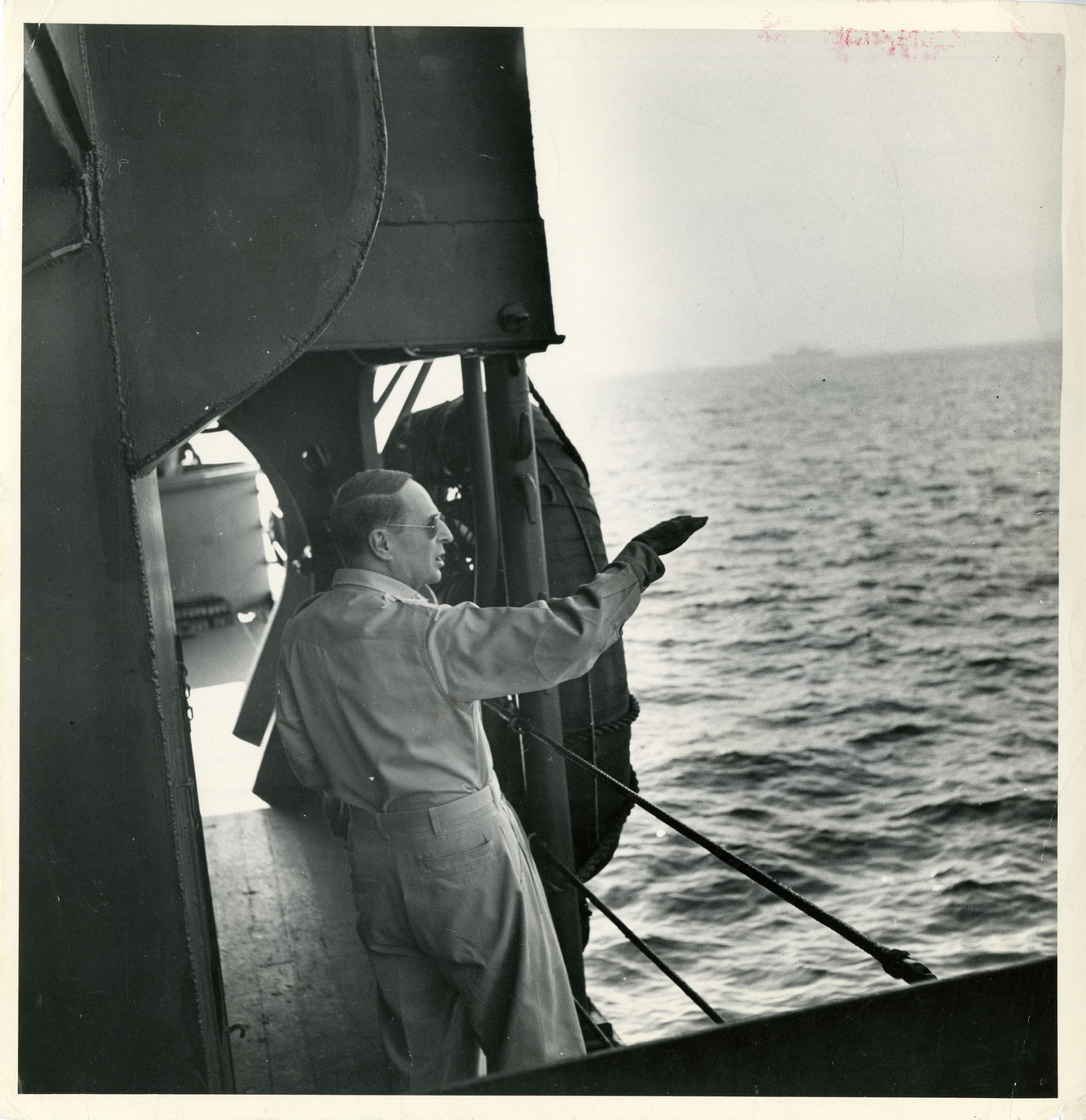 Text from the back of the print in LIFE's archives: "On way to Luzon Jan. 1945 - Landing Operation- Gen. Douglas MacArthur aboard ship."