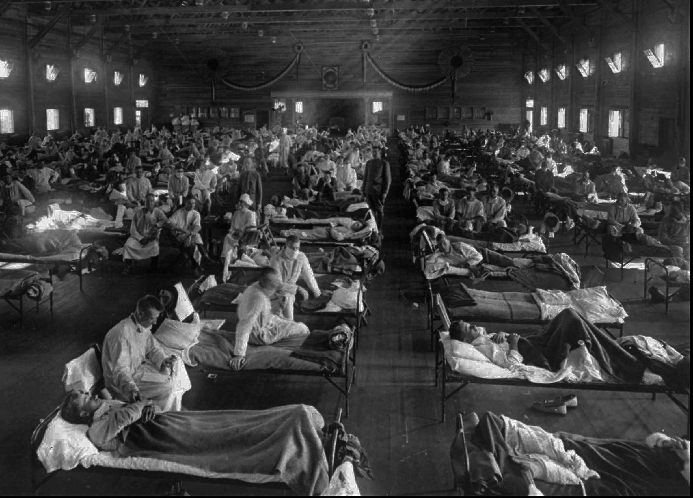 Influenza victims crowd into an emergency hospital near Fort Riley, Kans., in this 1918 file photo.