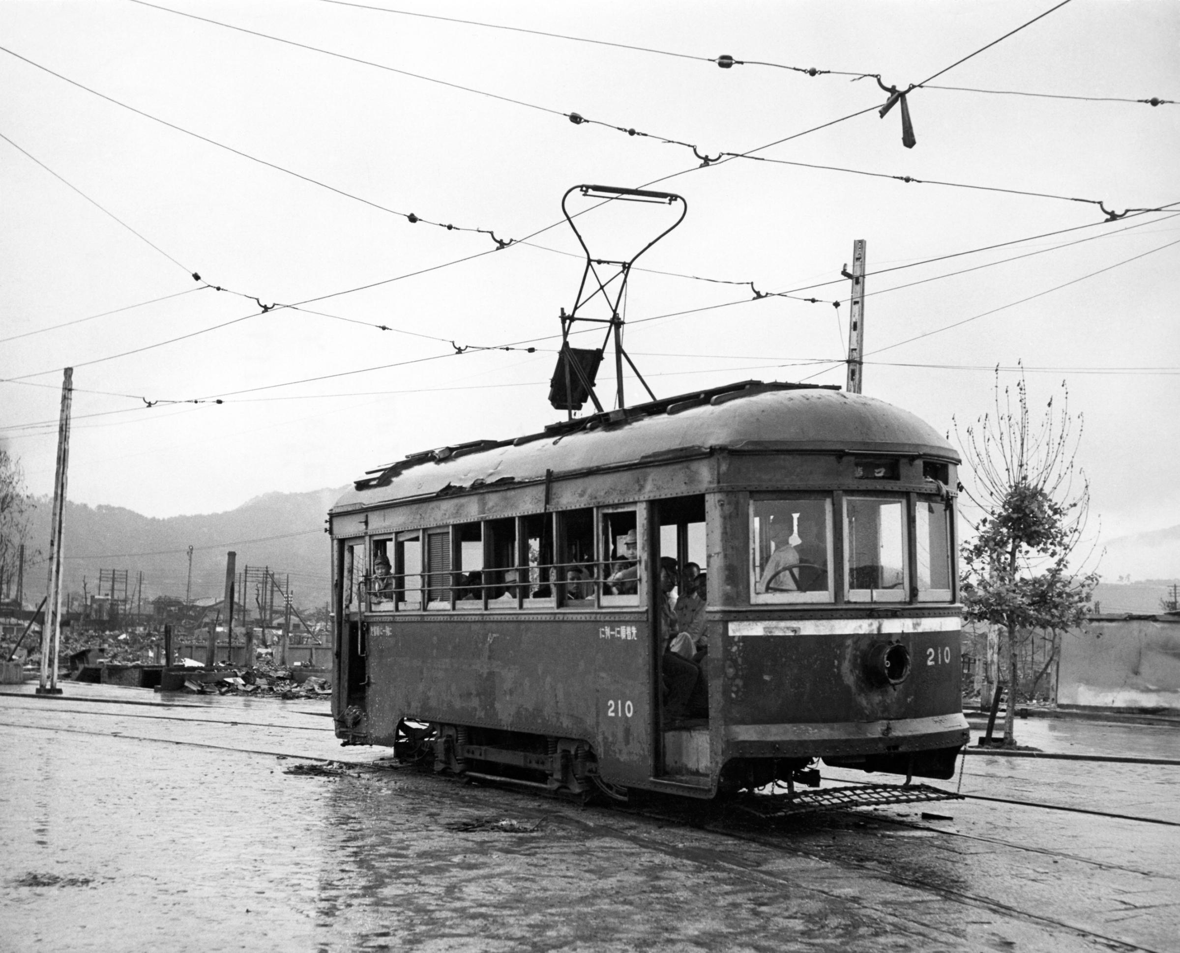 A passenger-filled streetcar, Hiroshima, Japan, September 1945.