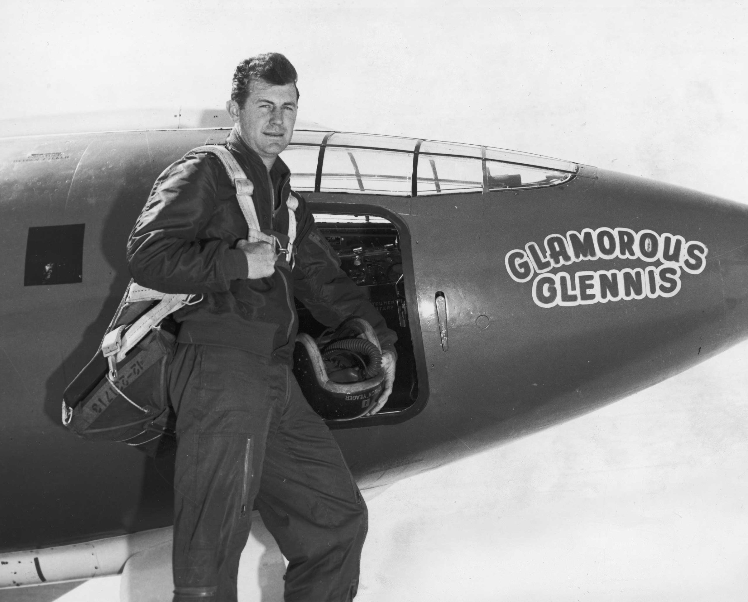 United States Air Force Capt. Chuck Yeager stands beside the plane in which he became the first pilot to break the sound barrier, 1947.