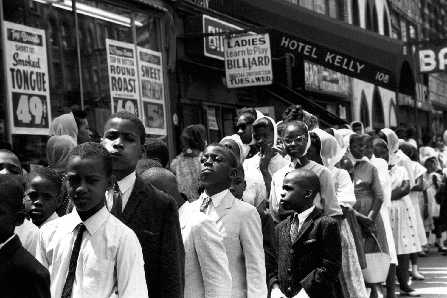 Children line up outside a Nation of Islam meeting at the Uline Arena, Washington, D.C., 1961.