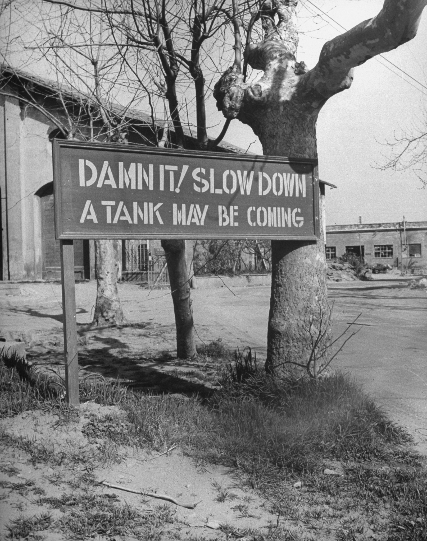 Sign posted at intersection in American sector during the campaign to take the Anzio area from occupying German forces during World War II.