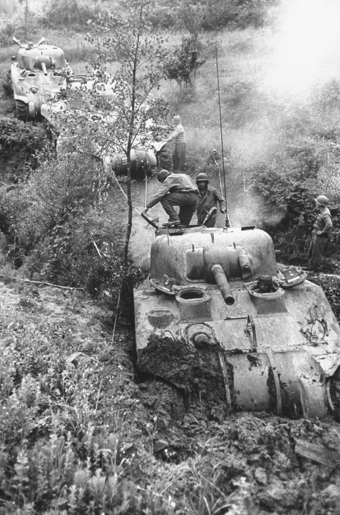 Column of American M4 Sherman tanks bogged down in the mud near Minturno during the campaign to drive German forces from Italy, 1944.
