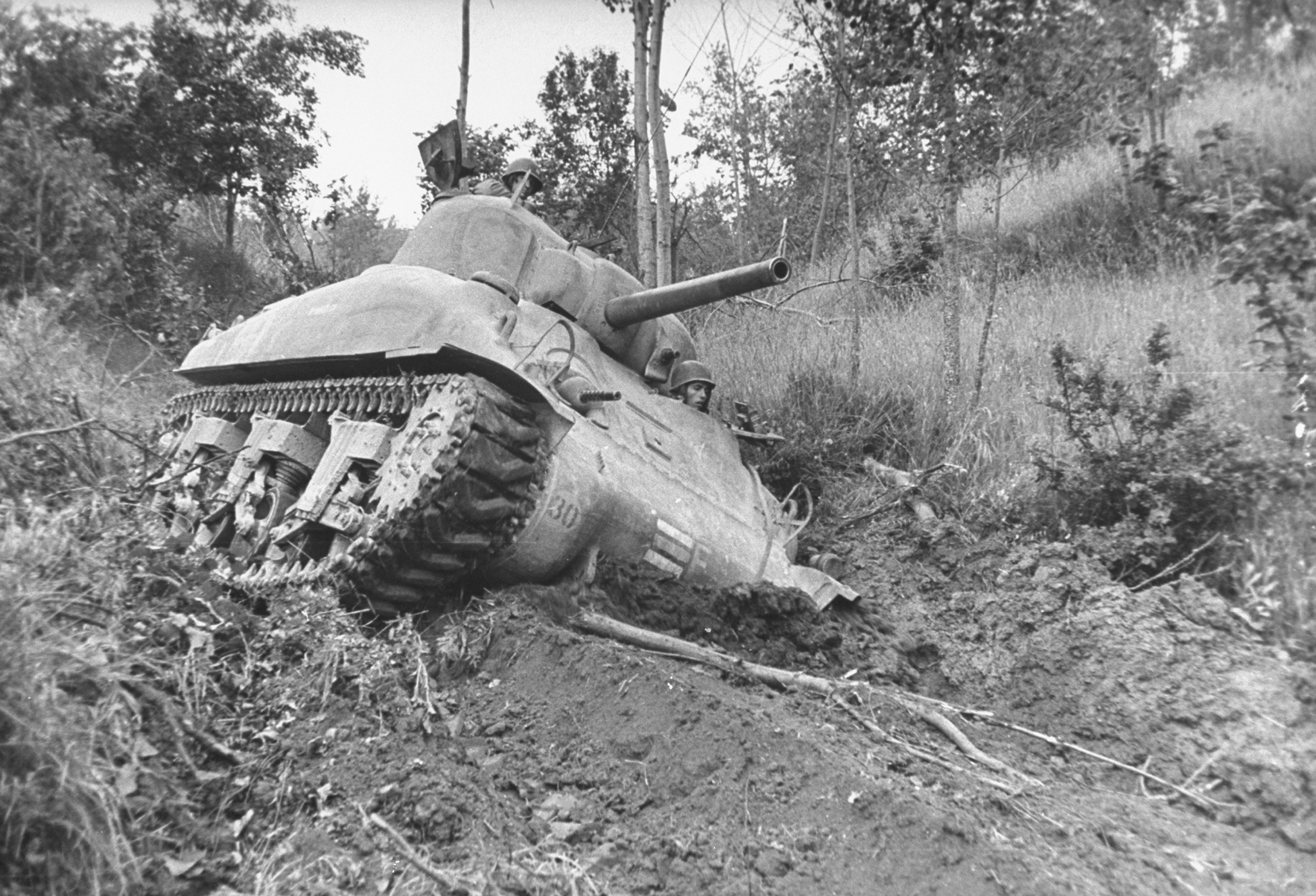 American M4 Sherman tank bogged down in the mud near Miturno during the campaign to drive German forces from Italy, 1944.