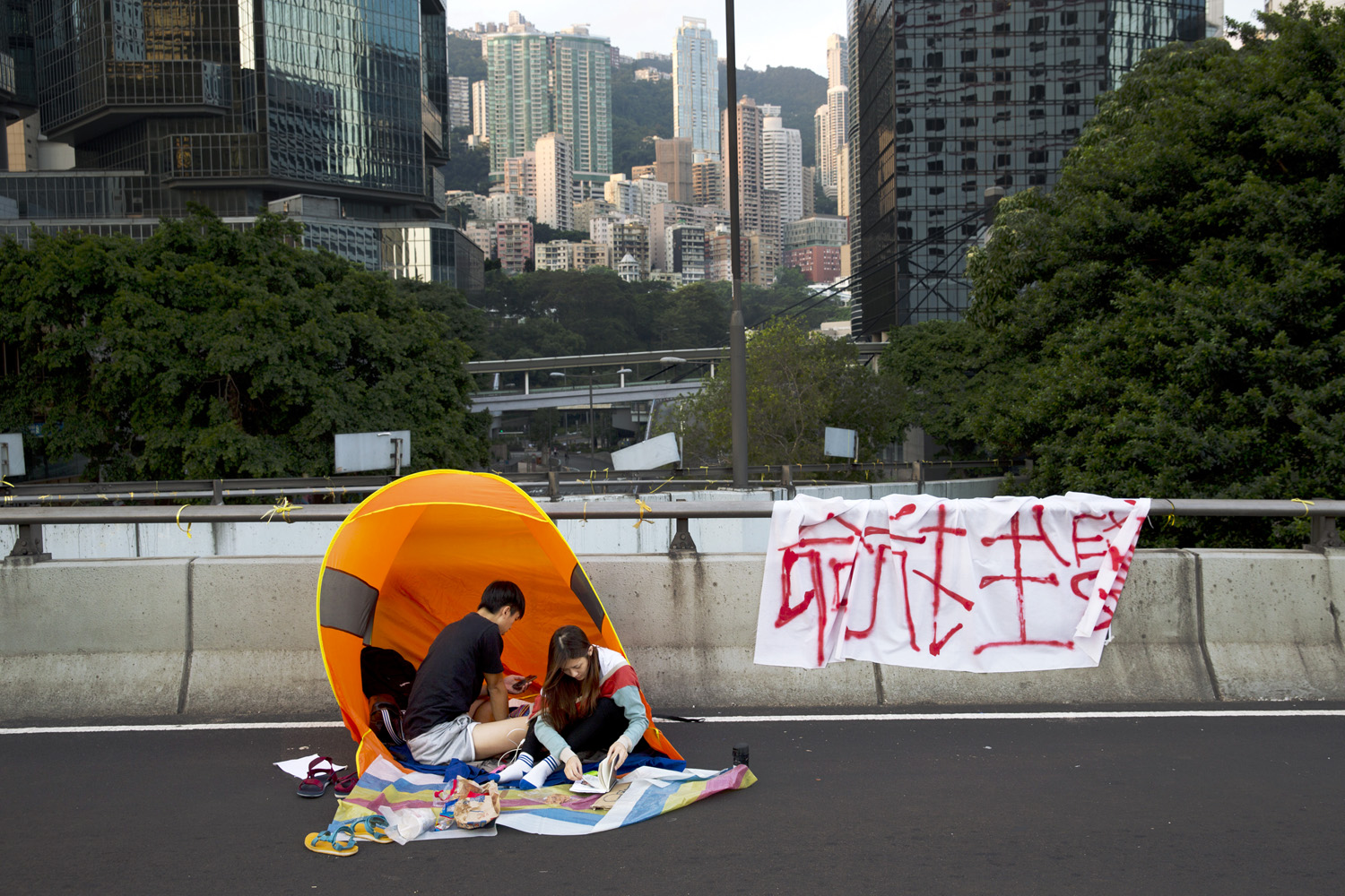 The crowds have dwindled, but thousands of people remain, camping on streets, in downtown Hong Kong.
