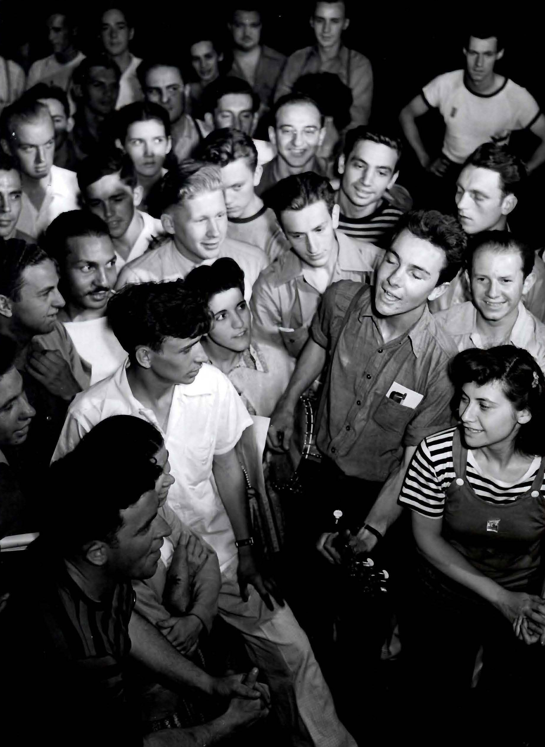 Pete Seeger surrounded by fans (undated)