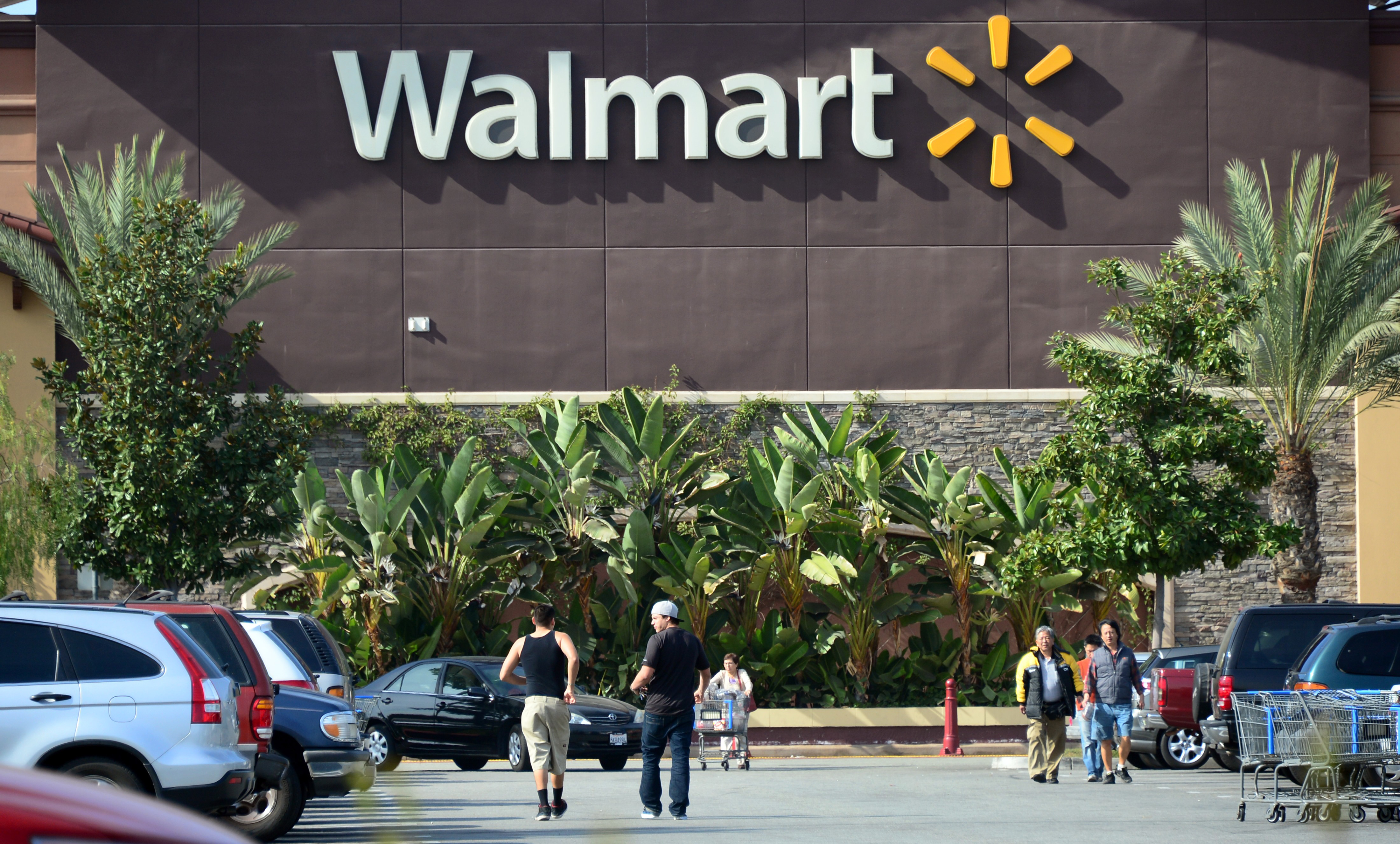 Shoppers are seen outside a Walmart store in Rosemead, Calif. on Jan. 29, 2014. (Frederic J. Brown—AFP/Getty Images)