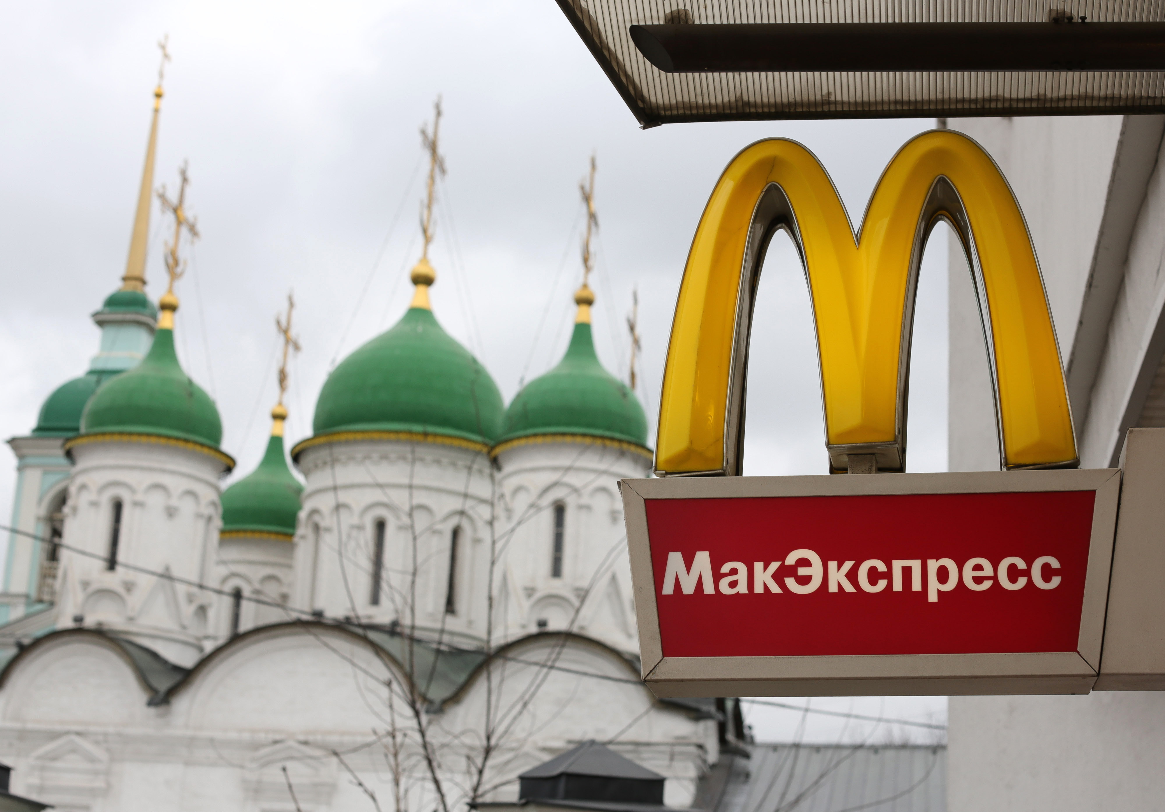 A logo hangs on display outside a McDonald's food restaurant in Moscow, Russia, on Sunday, April 7, 2013. (Andrey Rudakov—Bloomberg / Getty Images)