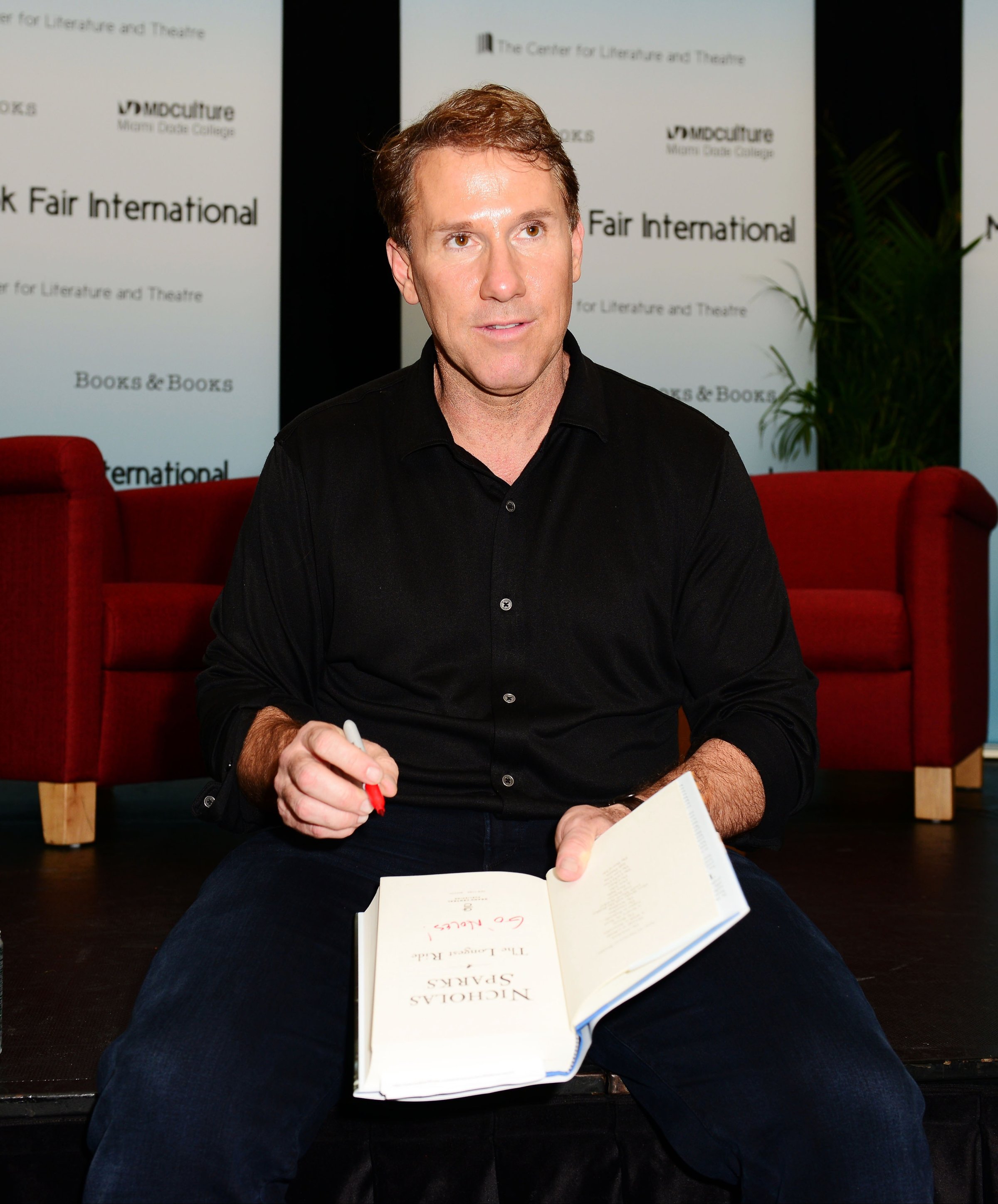 Author Nicholas Sparks discusses his book "The Longest Ride" presented by Books and Books at Chapman Conference Center at Miami Dade College on Sept. 30, 2013 in Miami.