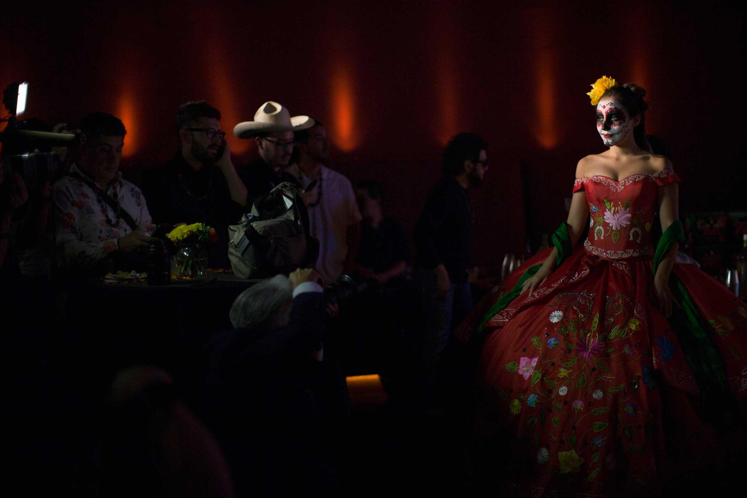A model is pictured during a Quinceanera Magazine Catrina fashion show at a press reception ahead of the 15th annual Dia de los Muertos, or Day of the Dead, festival at Hollywood Forever Cemetery in Los Angeles