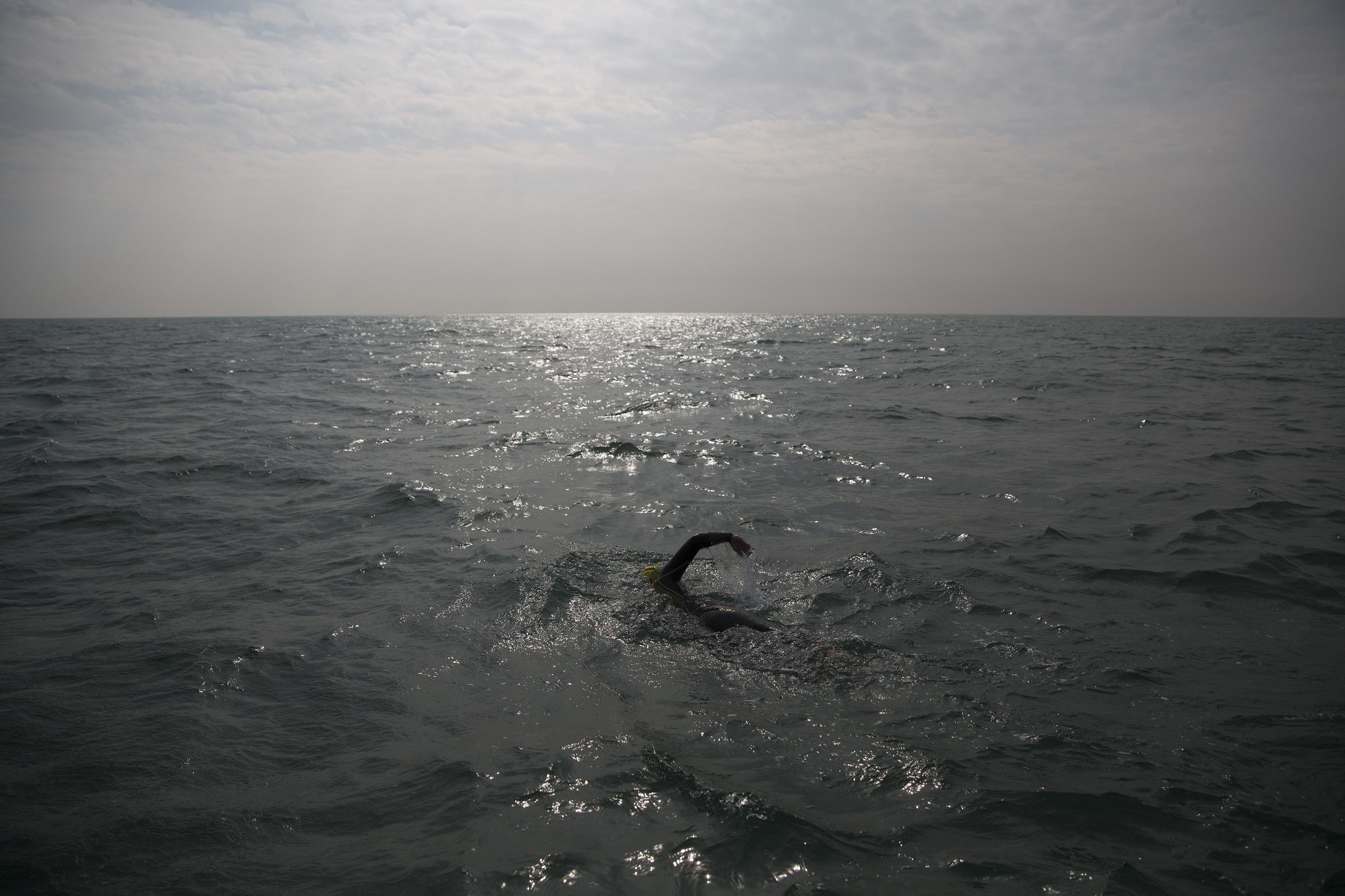 Paul Parrish swims as he takes part in the Arch to Arc triathlon in the channel between England and France September 15, 2014.