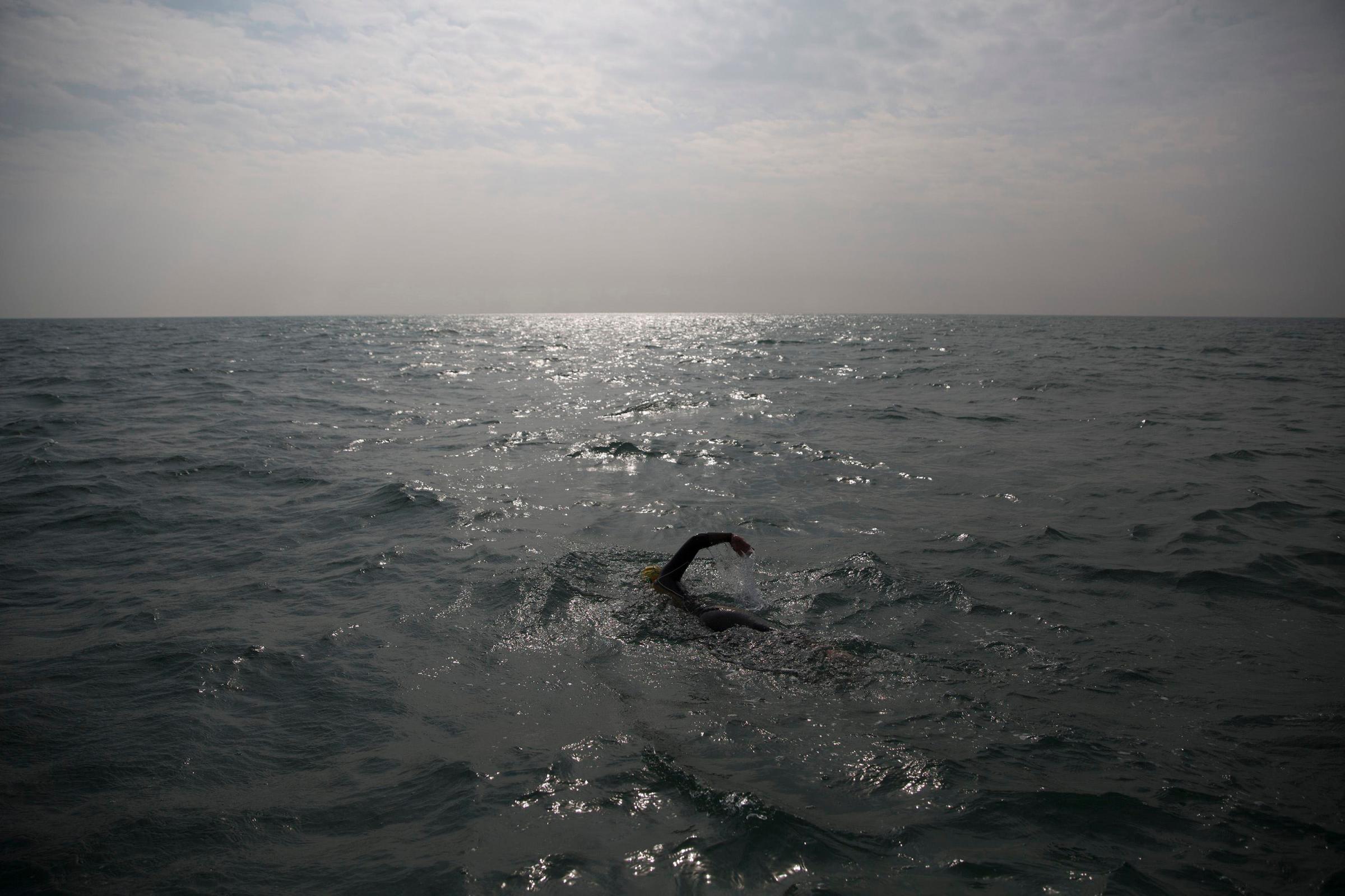 Paul Parrish swims as he takes part in the Arch to Arc triathlon in the channel between England and France