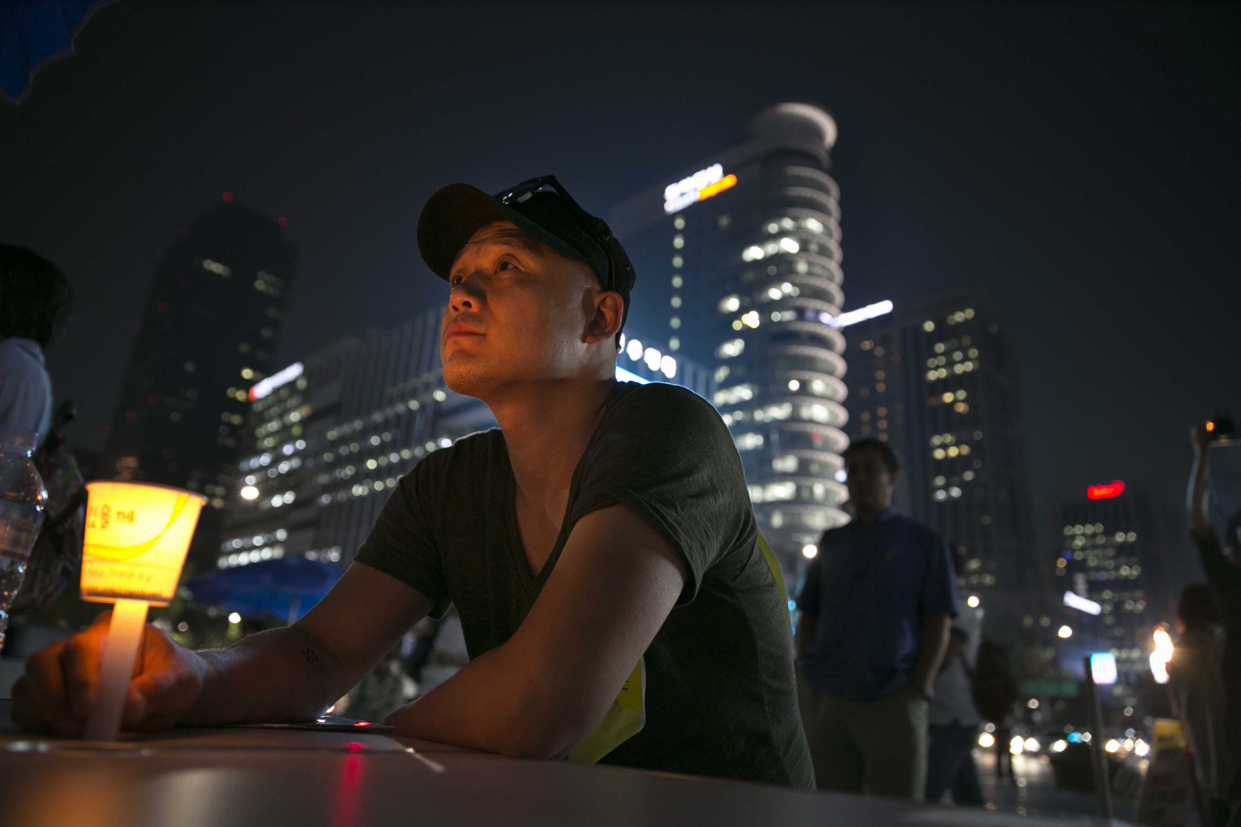 A man holds a candle as protesters continue their fight at the Sewol ferry protest camp September 16, 2014 in Seoul, South Korea. (Paula Bronstein—Getty Images)