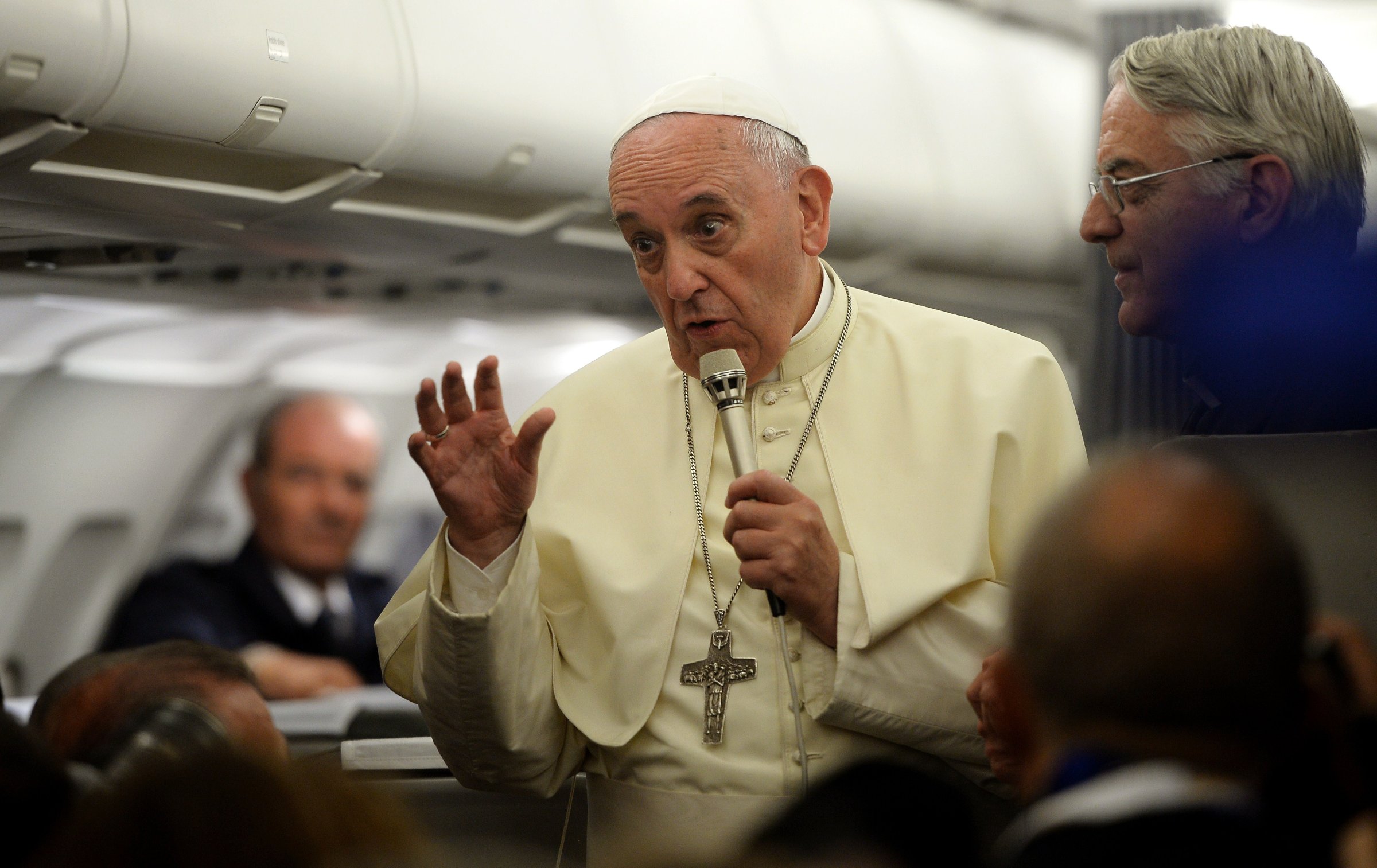 Pope Francis gives a press conference as he flies back to Rome from Tirana, on September 21, 2014.