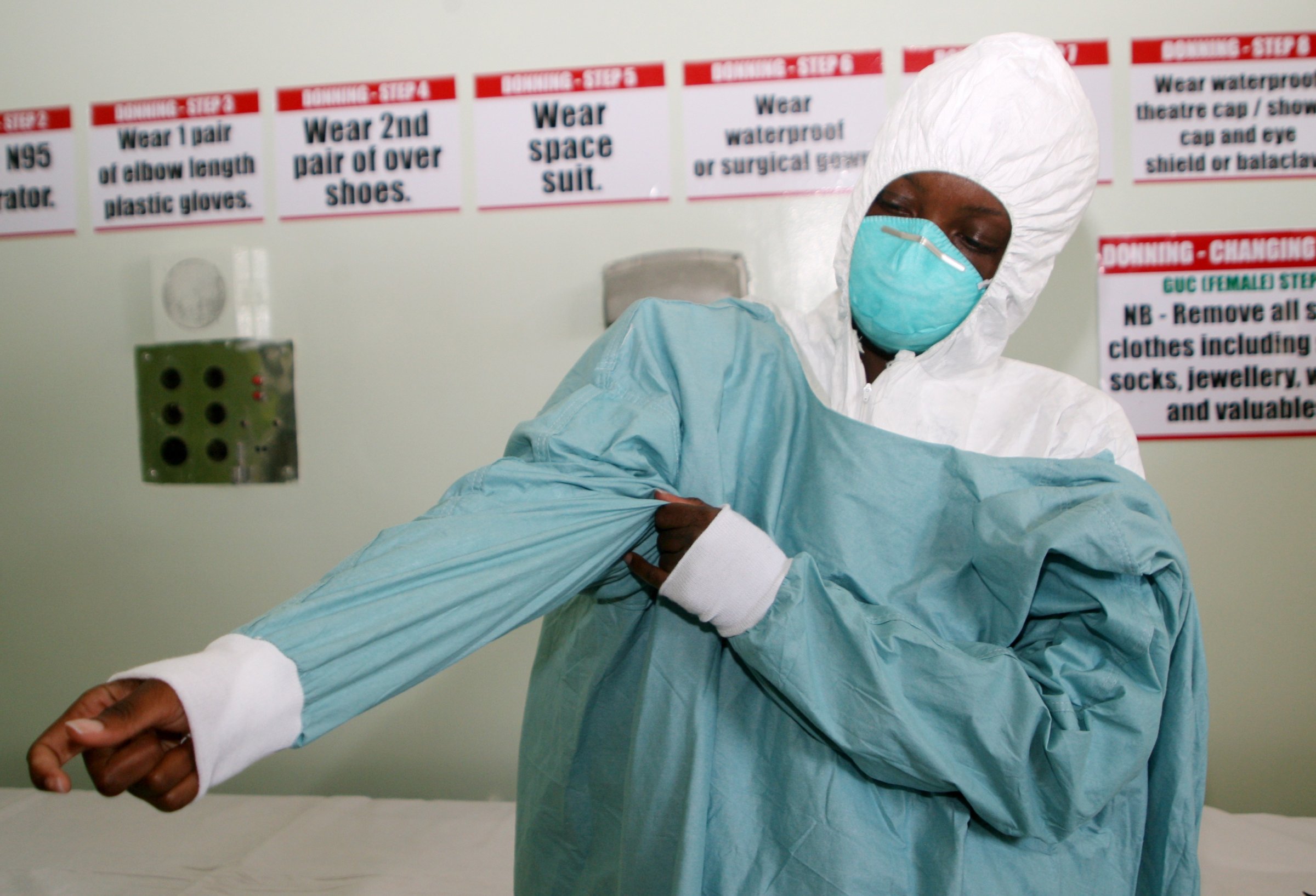 A nurse puts on protective gear during a demonstration at a quarantine unit set up at Wilkins Infectious Diseases Hospital in Harare on Sept. 26, 2014 to deal with ebola virus cases in the event of any outbreak.