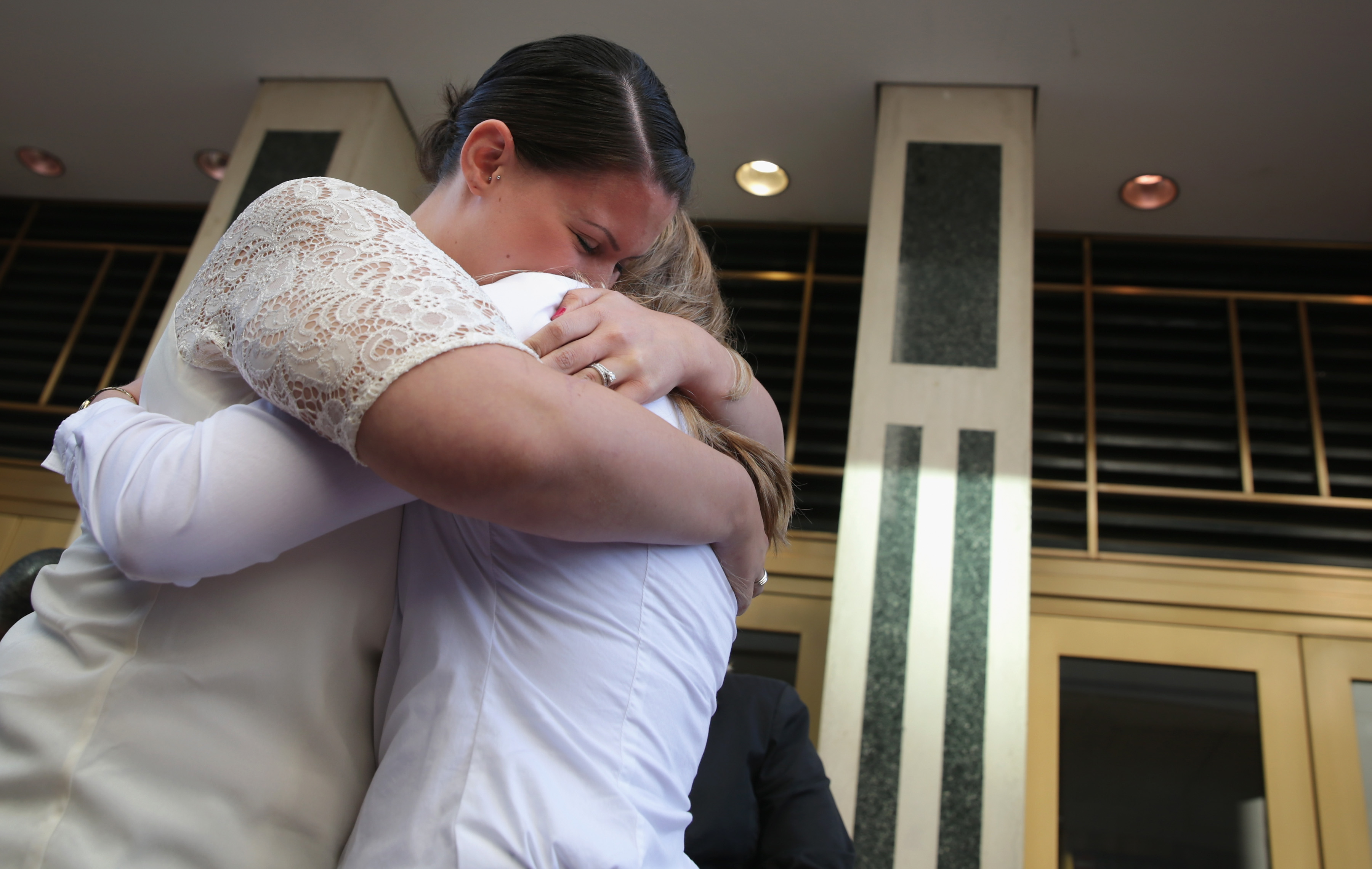 Erika Turner and Jennifer Melsop of Centreville, Va., embrace each other after they became the first same-sex married couple in Arlington County at the Arlington County Courthouse in Arlington, Va., on Oct. 6, 2014 (Alex Wong&mdash;Getty Images)
