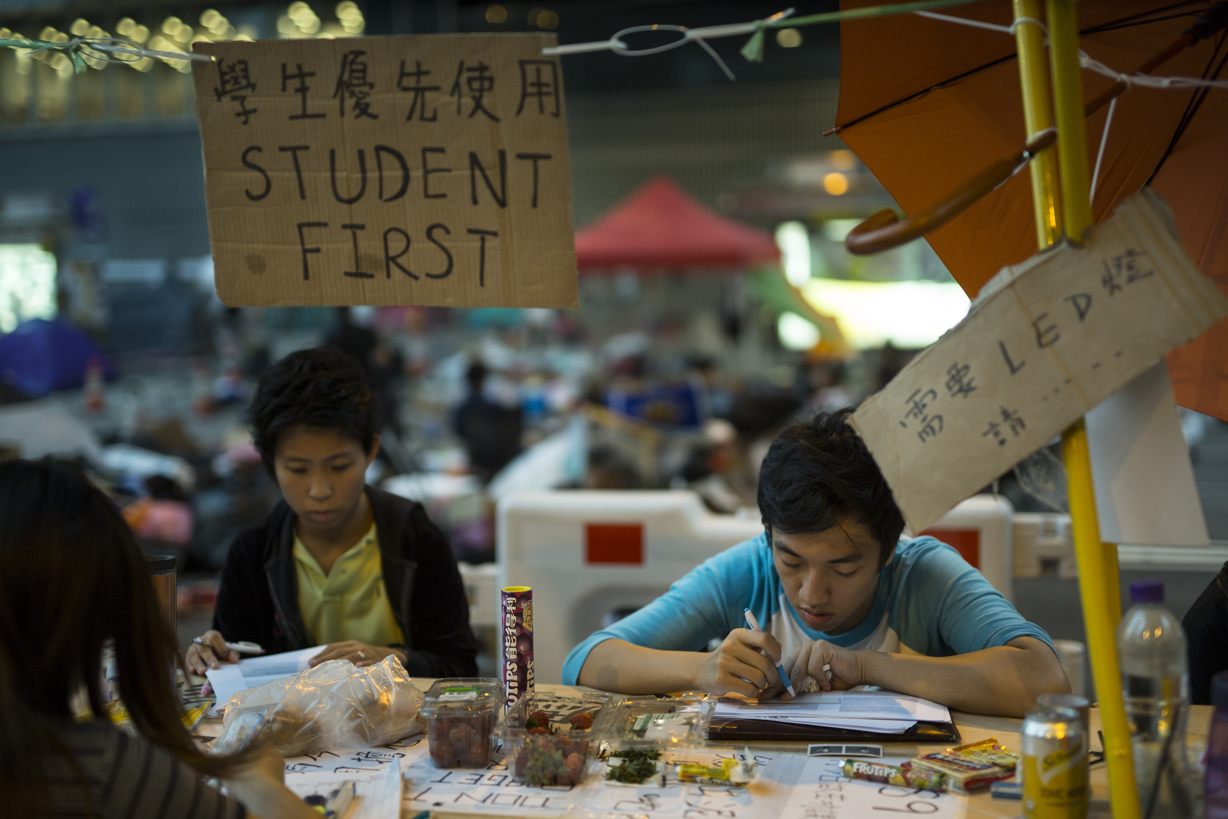 Students do their homework at a study area at the protest site in Hong Kong on Oct. 10, 2014 (Paula Bronstein—Getty Images)