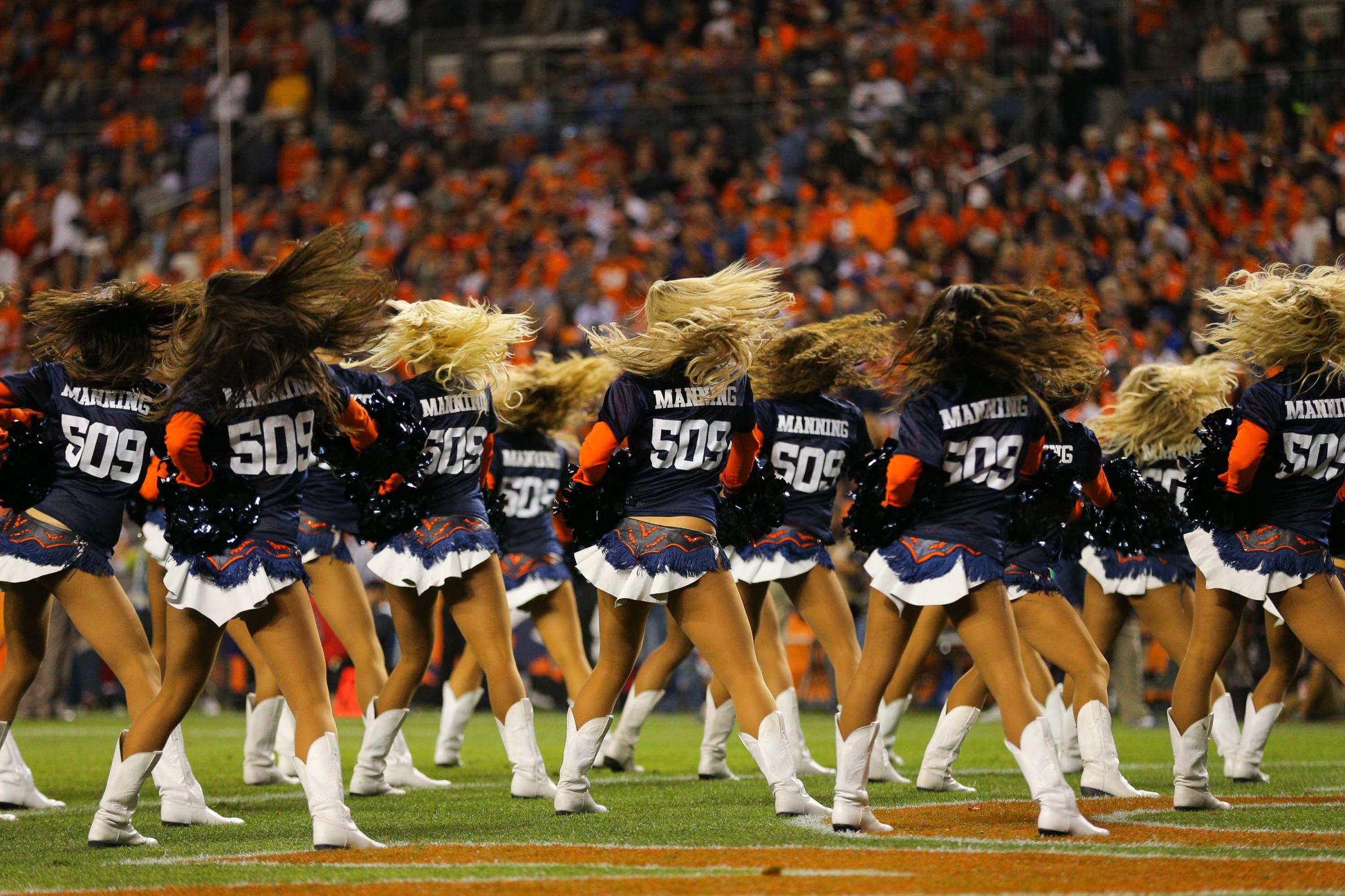 Denver Broncos cheerleaders perform wearing "509" jerseys celebrating quarterback Peyton Manning's record setting 509th career touchdown pass during a game between the Denver Broncos and the San Francisco 49ers at Sports Authority Field at Mile High on Oct. 19, 2014 in Denver.