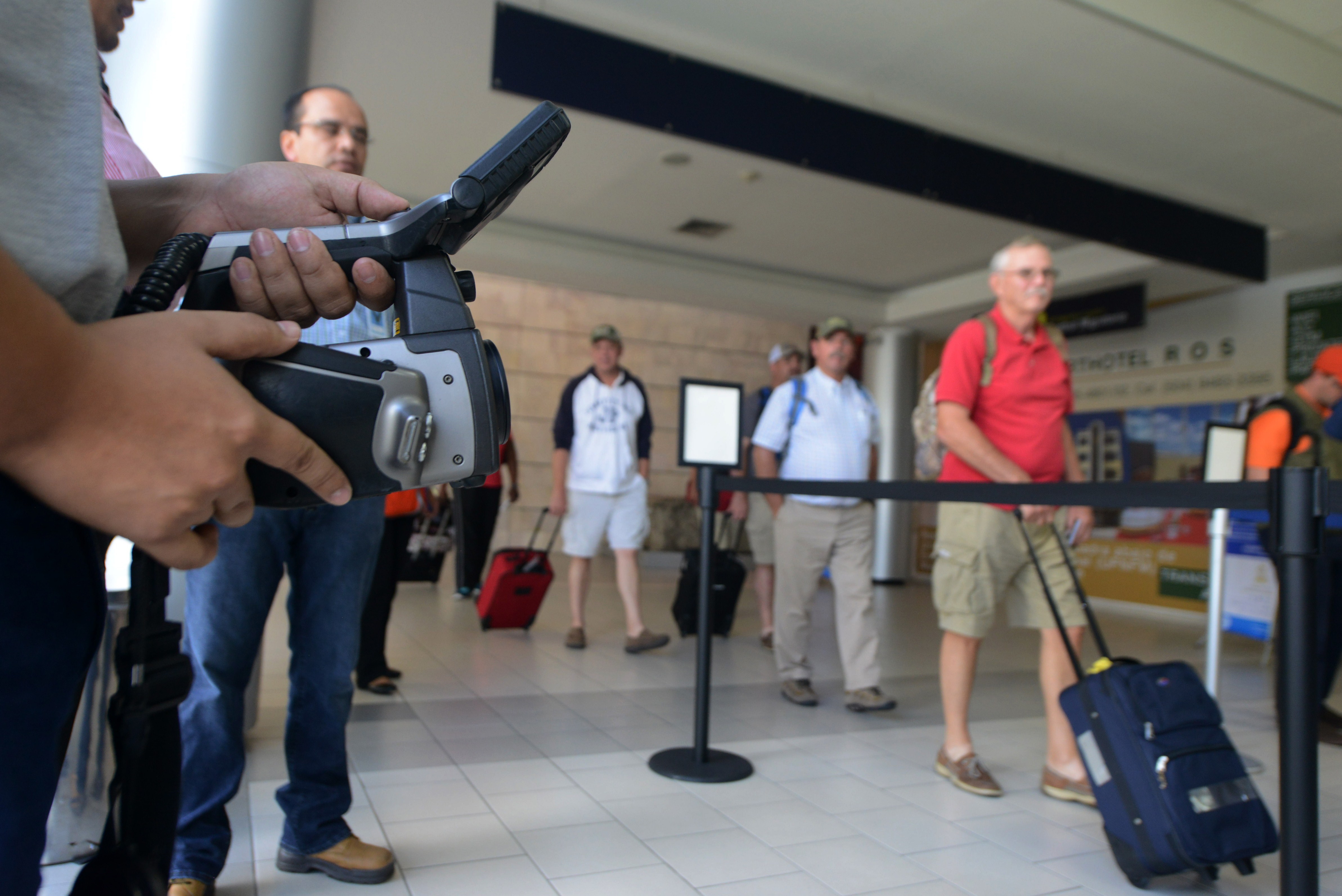 Honduras' Health personnel screen arriving passengers for the deadly Ebola virus at Tegucigalpa's Toncontin international airport on October 20, 2014. (ORLANDO SIERRA&mdash;AFP/Getty Images)