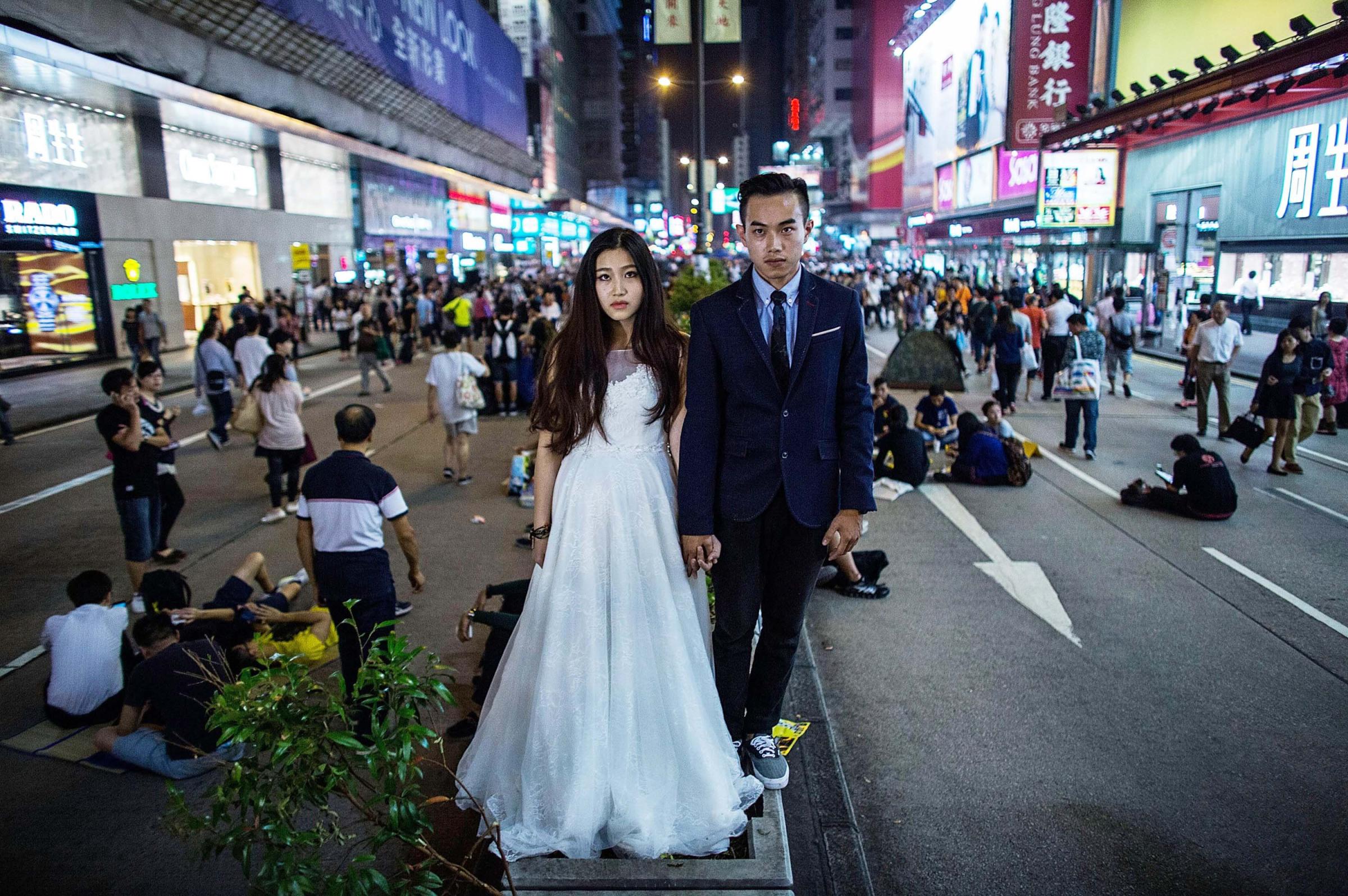 A Chinese couple takes pre-wedding photos at the occupation zone at Mongkok on Oct. 21, 2014 in Hong Kong.