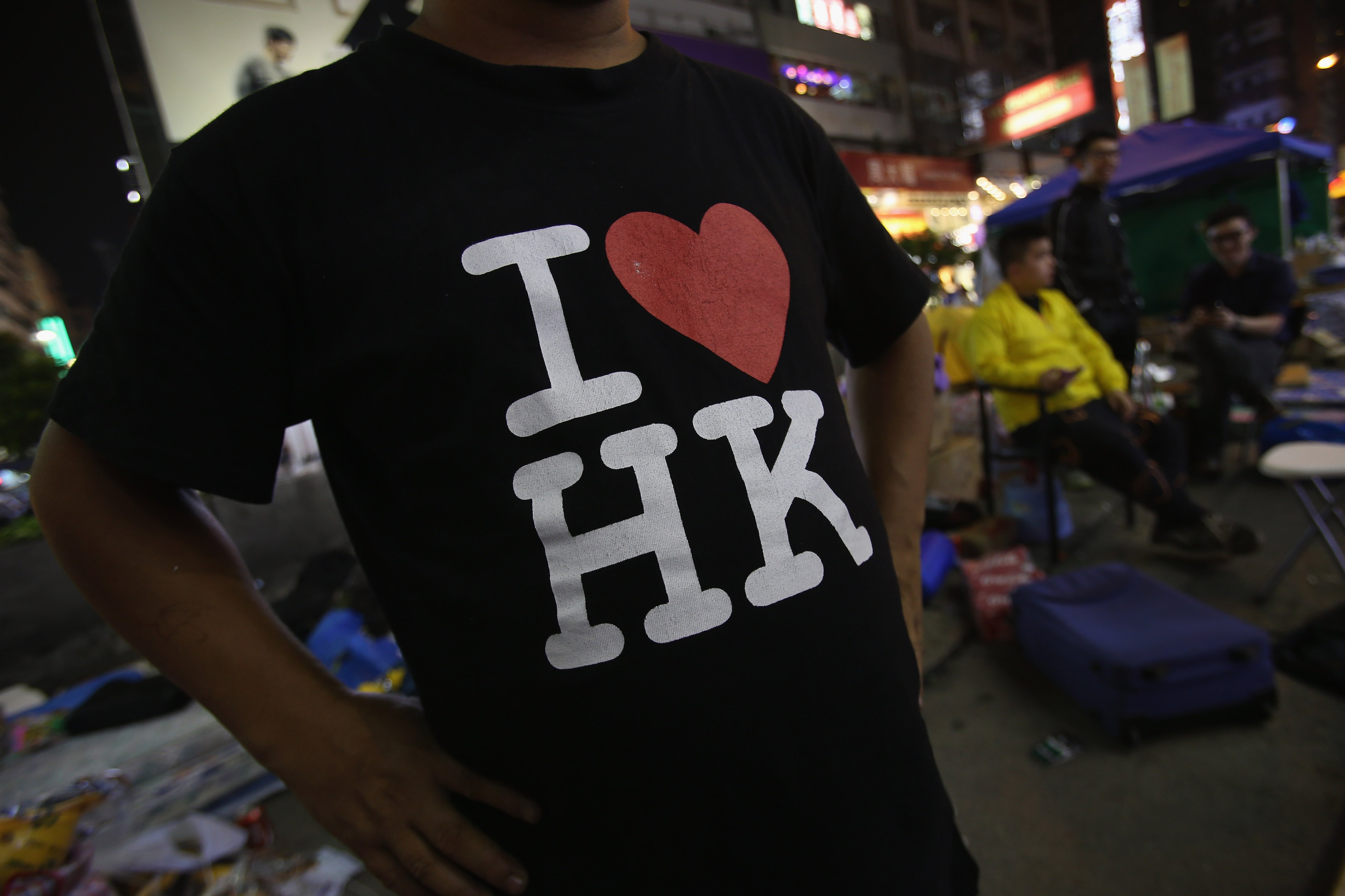 A pro-democracy protester displays his T-shirt on a street in Mongkok district on October 22, 2014 in Hong Kong. (Kong Ng—Getty Images)