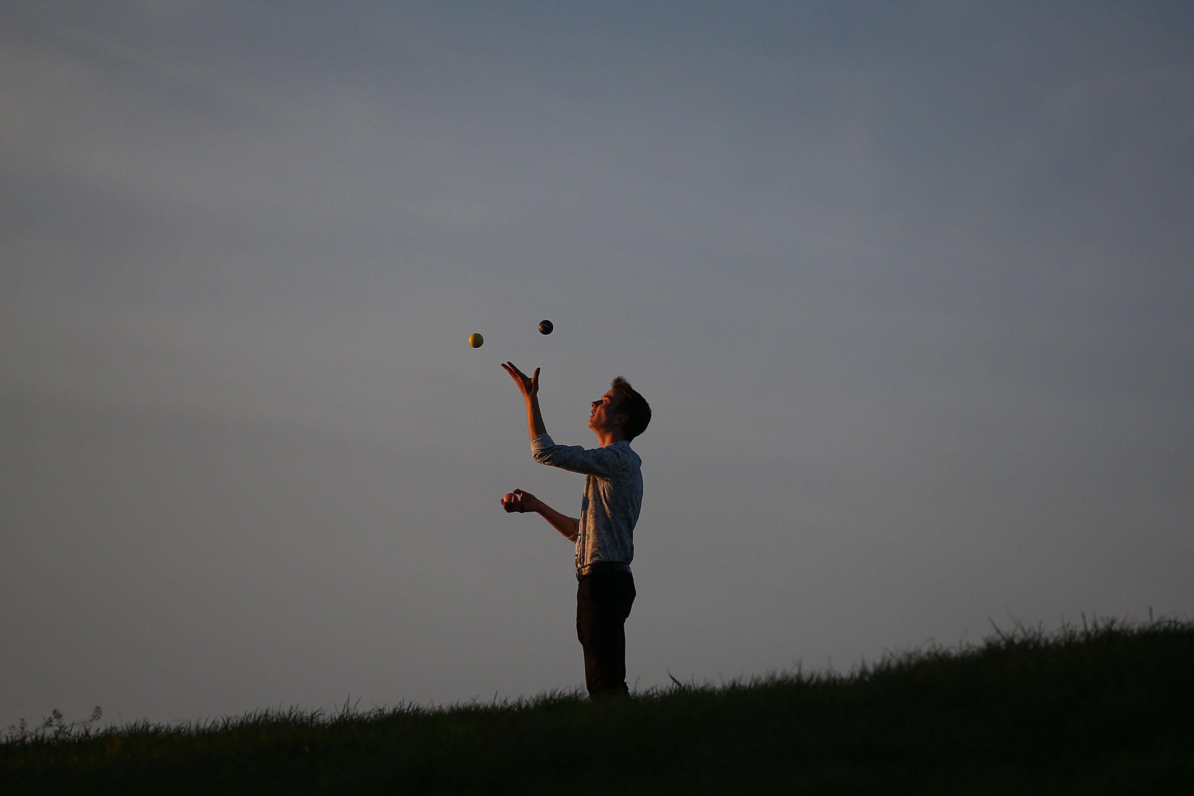 A man juggles on Primrose Hill on October 28, 2014 in London, England.
