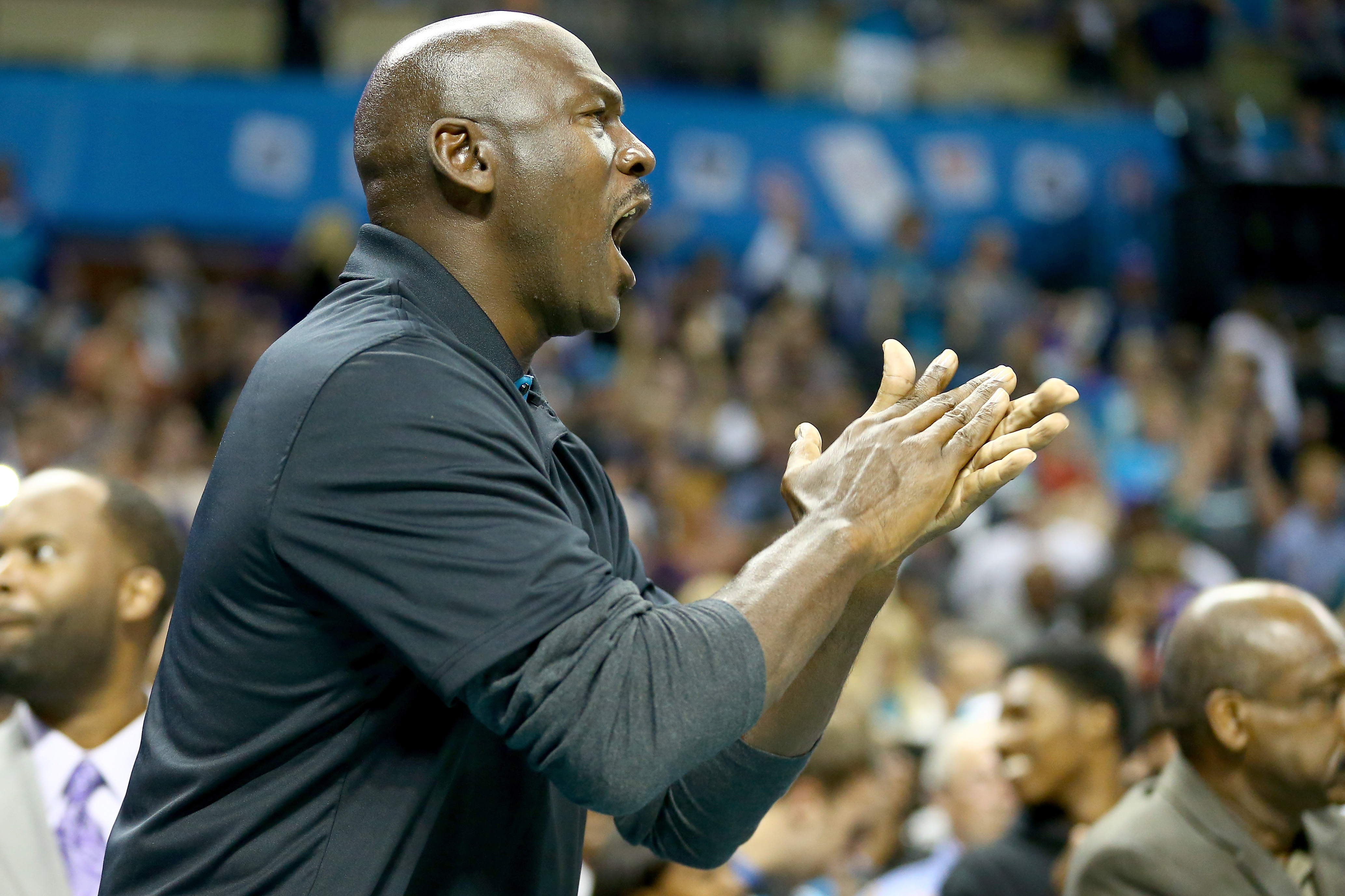Michael Jordan, owner of the Charlotte Hornets, watches on during their game against the Milwaukee Bucks at Time Warner Cable Arena on October 29, 2014 in Charlotte, North Carolina. (Streeter Lecka&mdash;Getty Images)