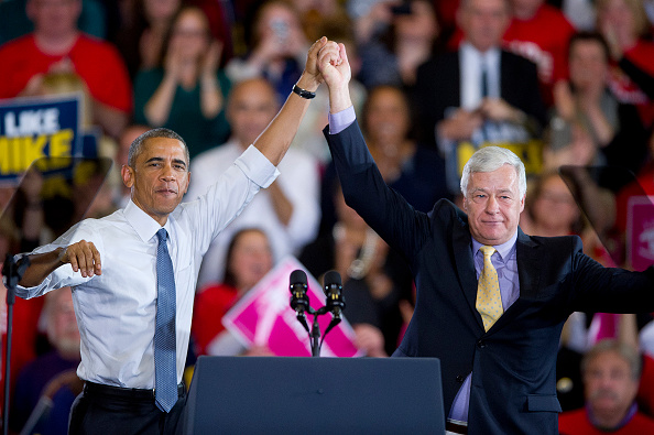 President Barack Obama and Democratic Representative Mike Michaud raise their hands at the Democratic candidate's gubernatorial-election campaign rally in Portland, Maine, on Oct. 30, 2014 (Portland Press Herald/Getty Images)