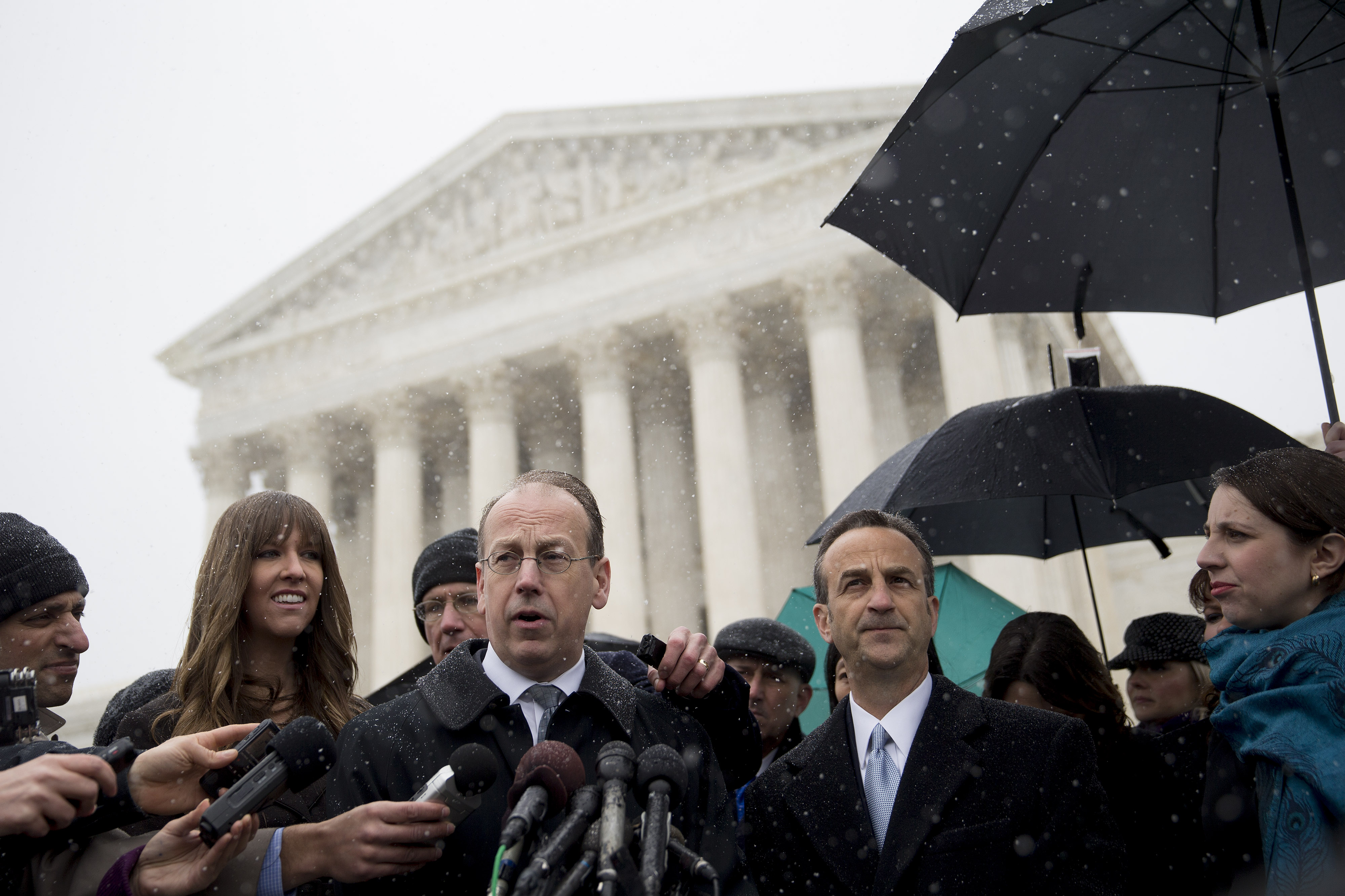 Paul Clement, lawyer arguing before the U.S. Supreme Court on behalf of Hobby Lobby Stores Inc. and Conestoga Wood Specialties Corp., center, speaks to the media with David Cortman, senior counsel and vice-president of religious liberty with Alliance Defending Freedom, right, following arguments in Washington, D.C., U.S., on Tuesday, March 25, 2014. (Bloomberg&mdash;Bloomberg via Getty Images)