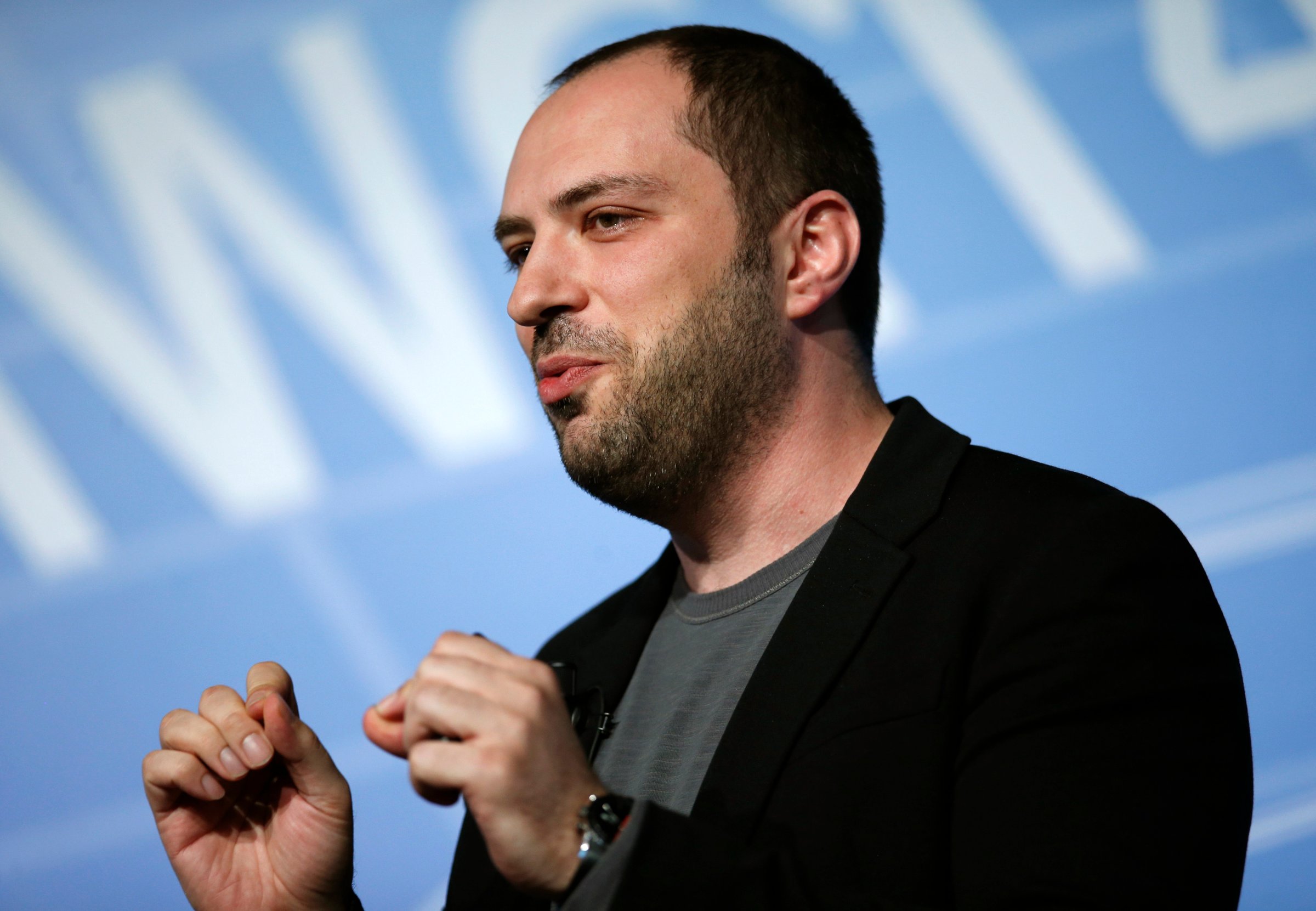 WhatsApp CEO and co-founder Jan Koum delivers a speech at the Mobile World Congress in Barcelona
