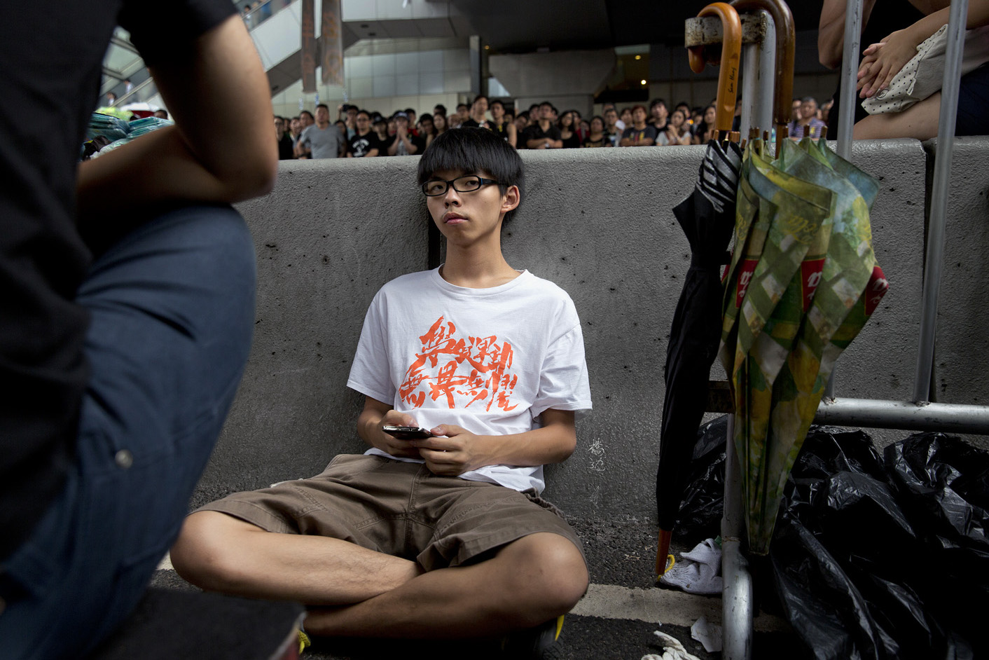 Democracy demonstrations in Hong Kong. Students and pro-democracy citizens being attacked and shouted at by anti-demonstration group in Mongkok. Pro-police rally. Joshua Wong, 17-year-old protest leader.by James Nachtwey