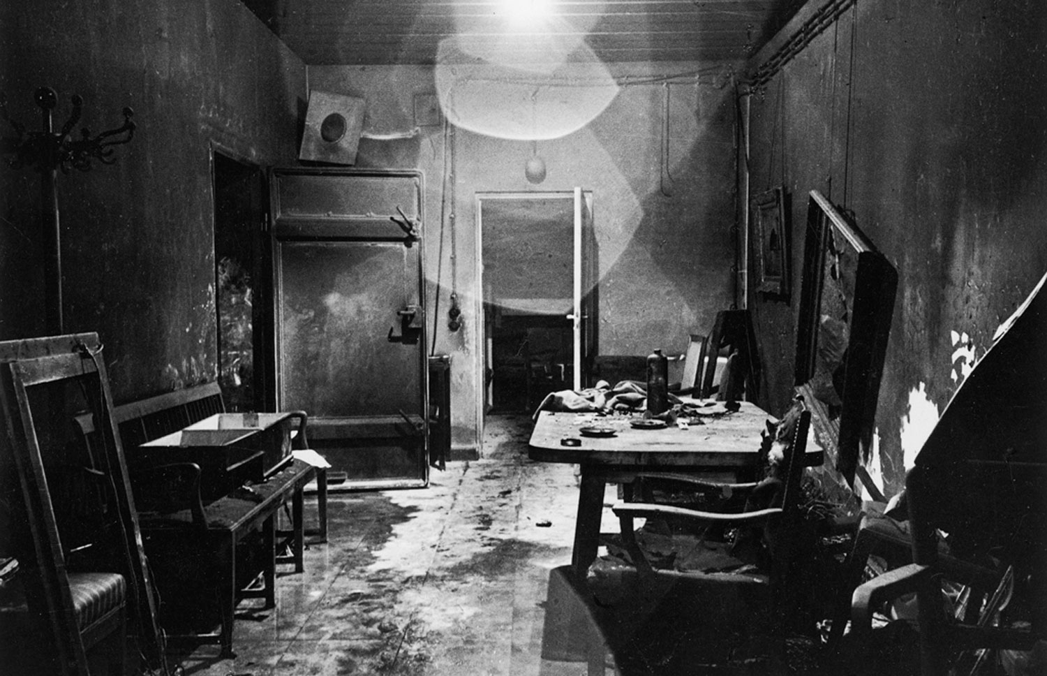 A new view of a photograph that appeared, heavily cropped, in LIFE, picturing Hitler's bunker, partially burned by retreating German troops and stripped of valuables by invading Russians.