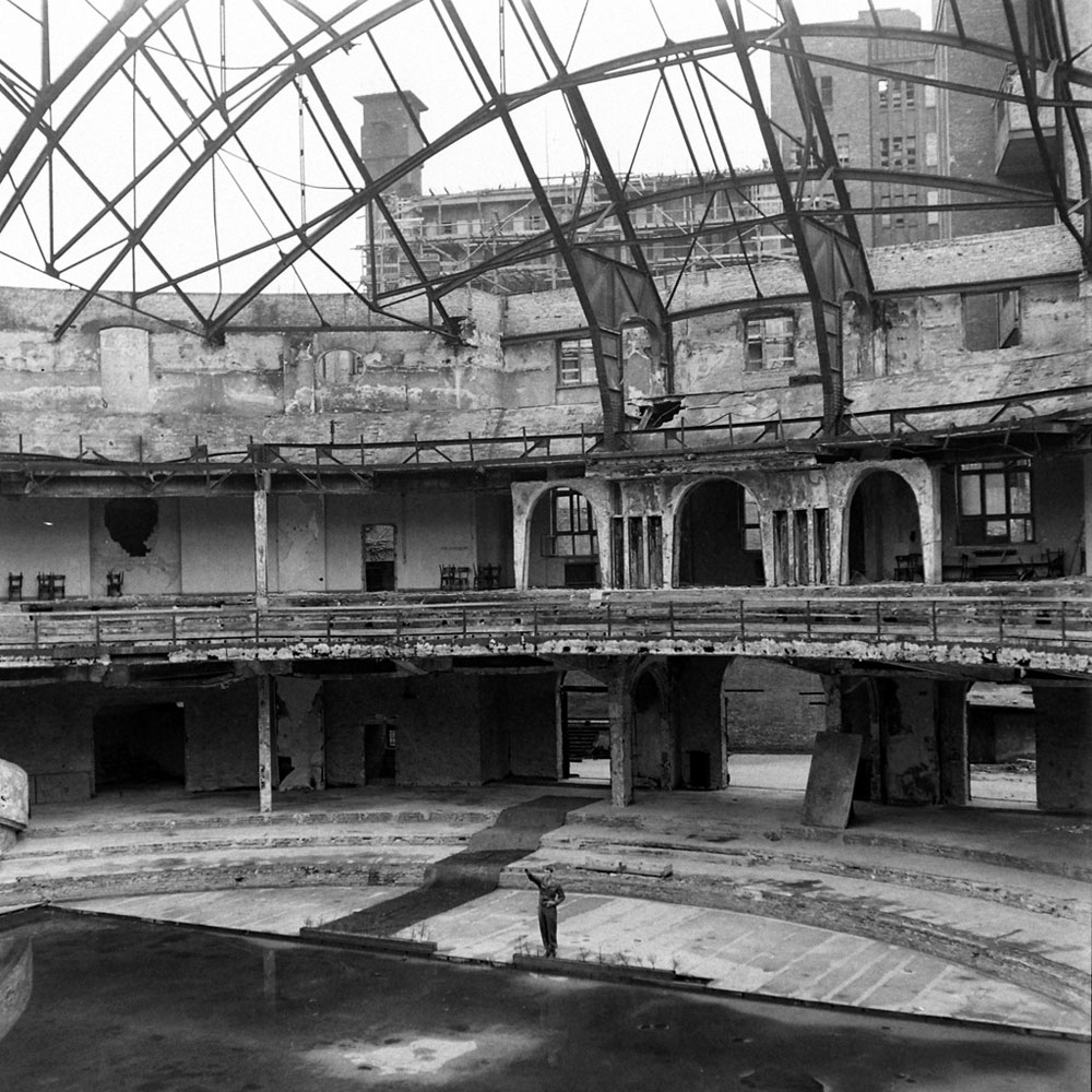 An American soldier, PFC Douglas Page, offers a mocking Nazi salute inside the bombed-out ruins of the Berliner Sportspalast, or Sport Palace. The venue, destroyed during an Allied bombing raid in January 1944, was where the Third Reich often held political rallies.